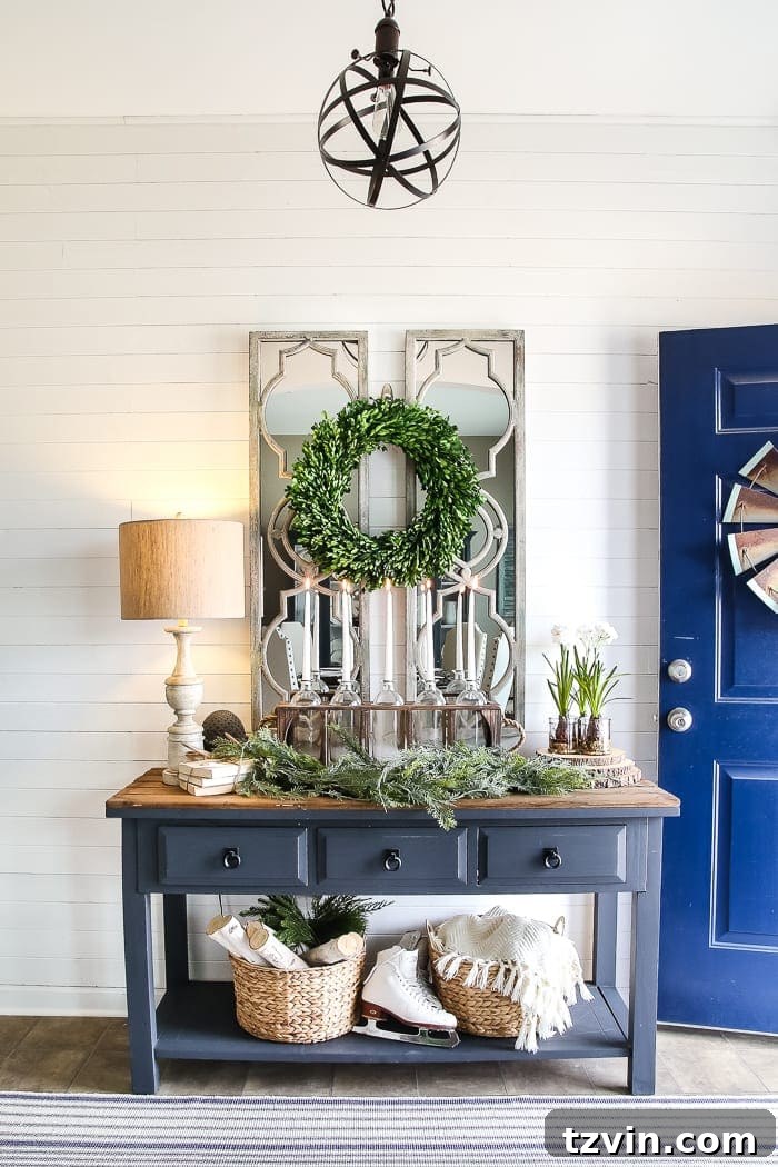 white shiplap wall molding in a foyer with entryway table