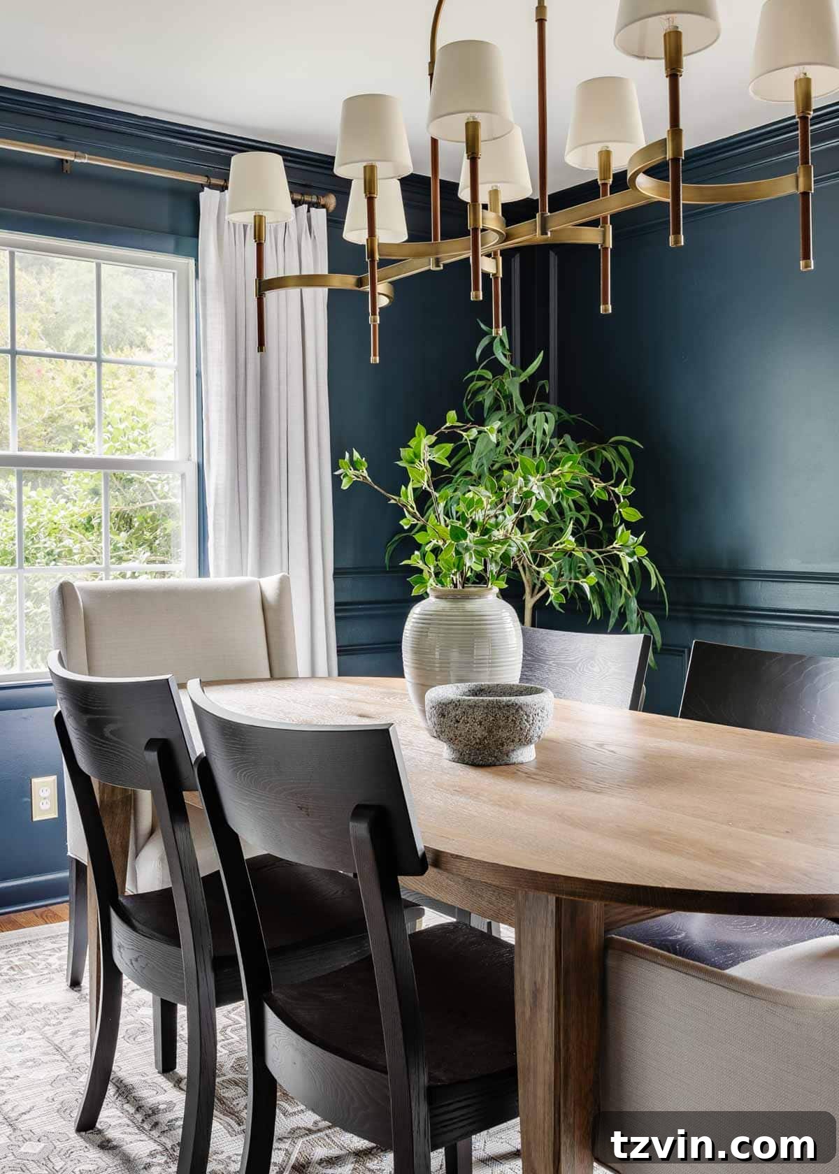 Bassett BenchMade Classic Modern Dining Furniture 3 classic modern dining room with navy walls, linen curtains, elegant wood table, and black chairs