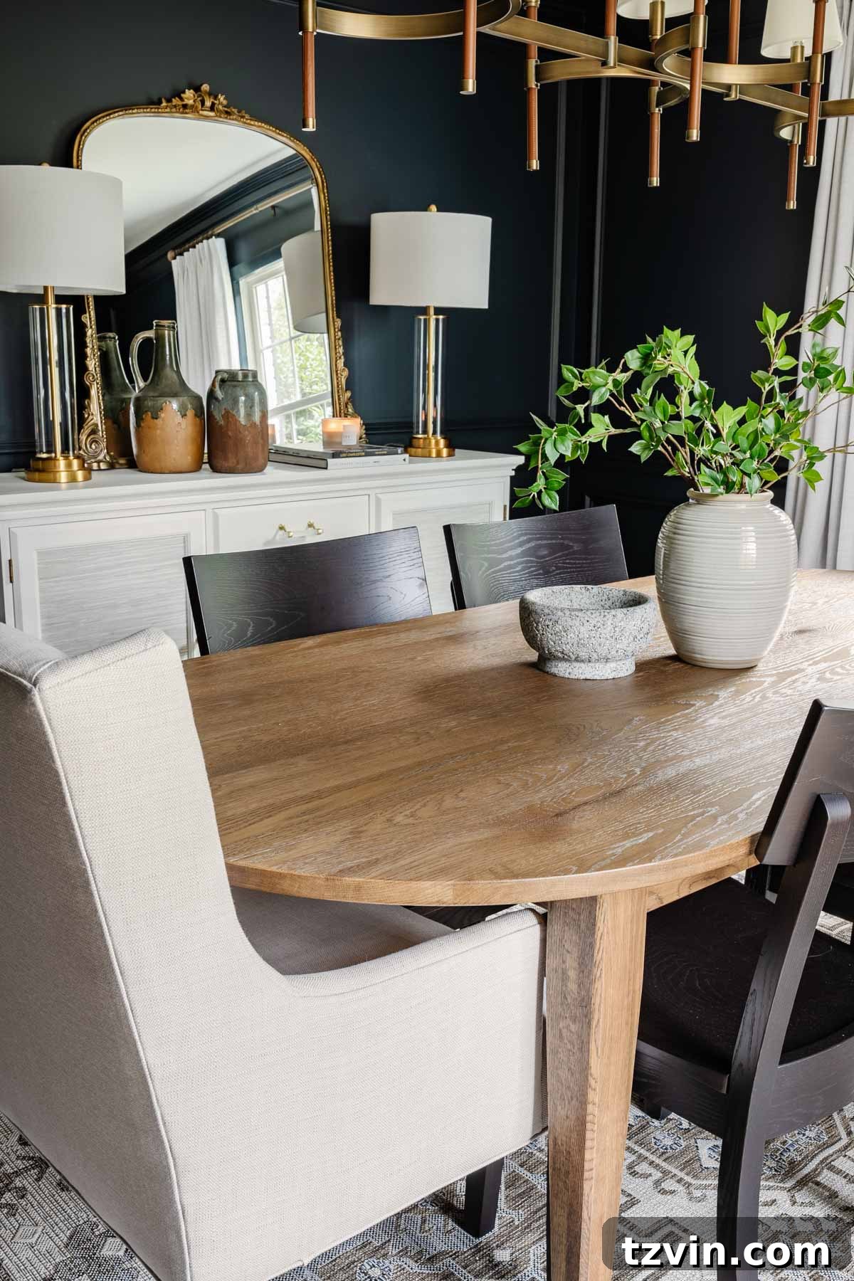Bassett BenchMade Classic Modern Dining Furniture 4 classic modern dining room with navy walls, linen curtains, wood MCM table, black chairs, and French mirror