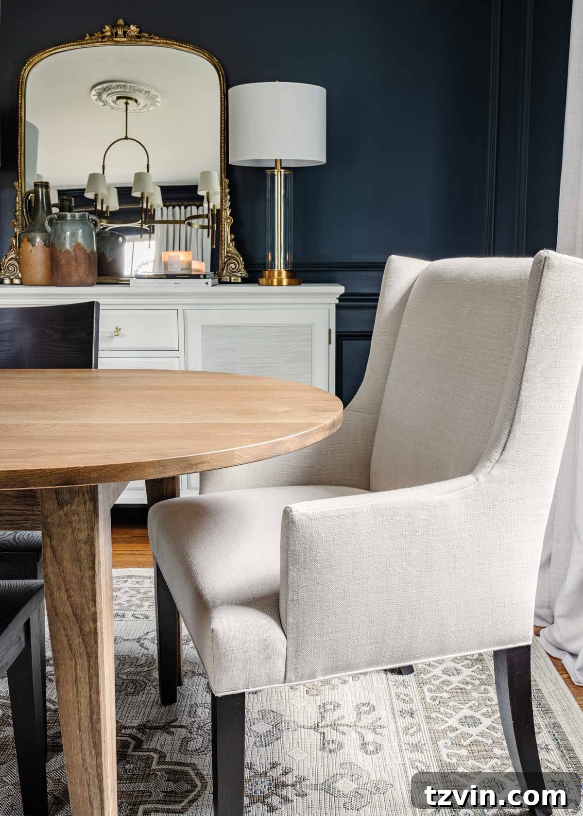 Bassett BenchMade Classic Modern Dining Furniture 9 midcentury modern dining table with upholstered chairs, navy walls, and french mirror