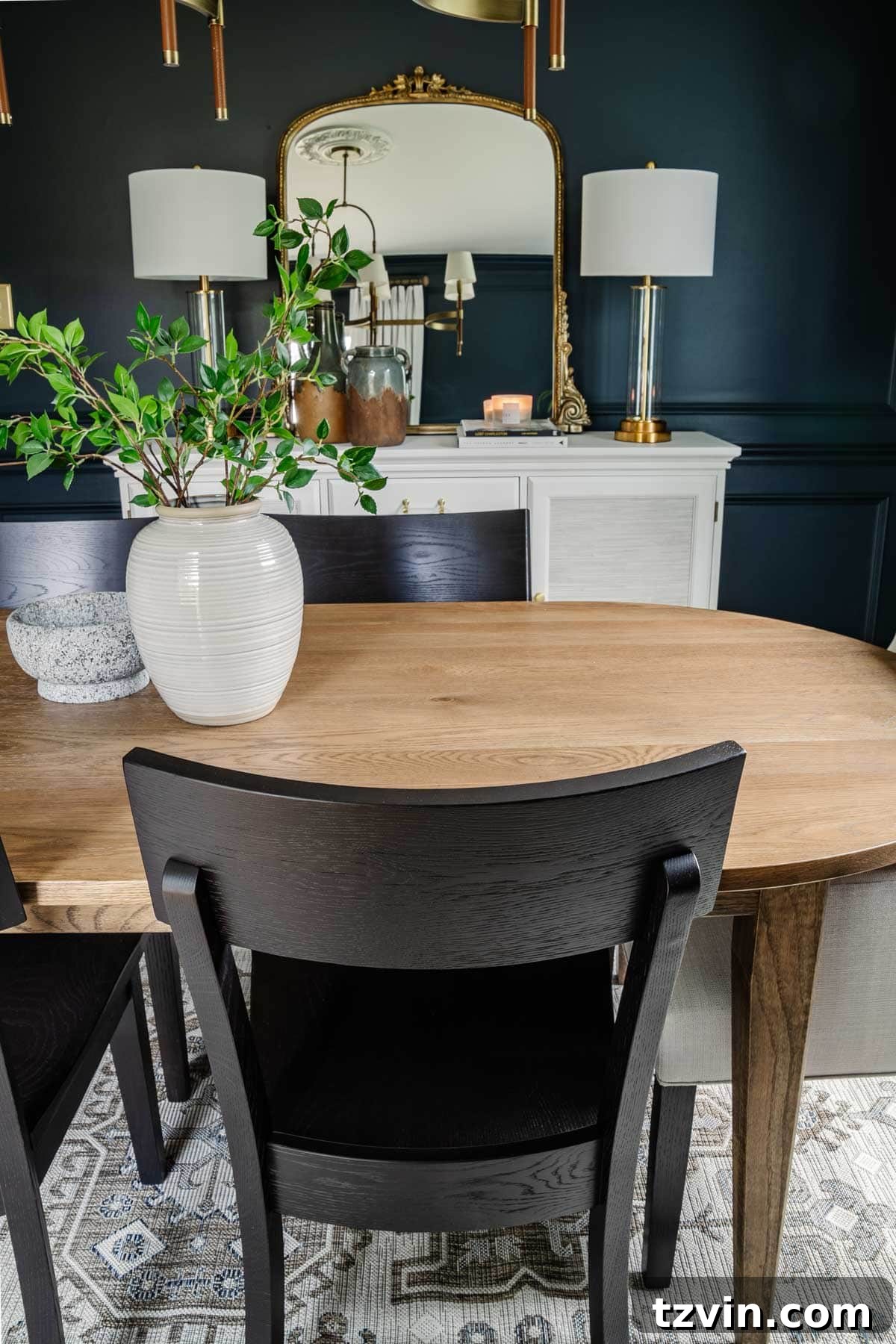 Bassett BenchMade Classic Modern Dining Furniture 10 classic modern dining room with midcentury modern table, black chairs, and French mirror