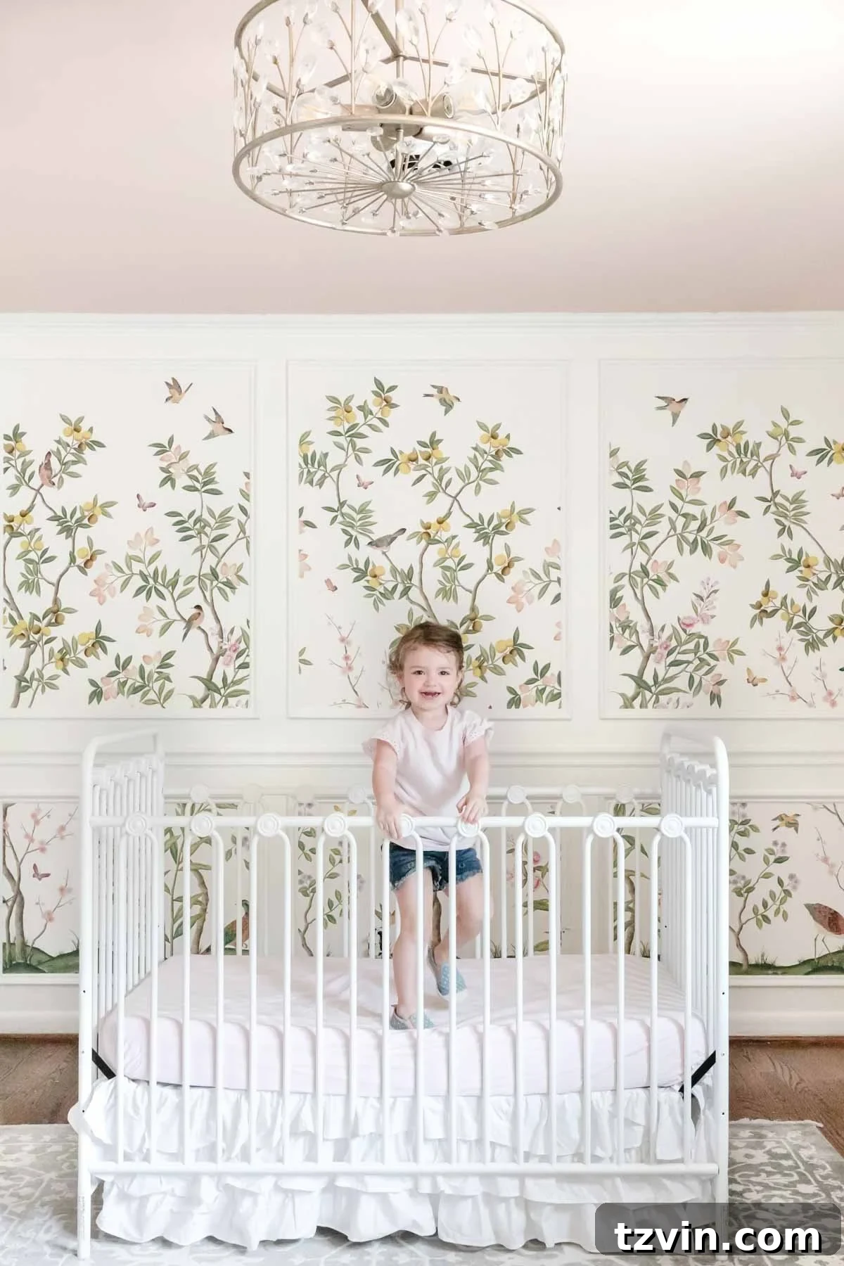 Create a Designer Look: Wallpapering Inside Picture Frame Molding 2 Chinoiserie wallpaper mural framed by picture frame molding in a girl's bedroom, creating a whimsical and traditional decor style.