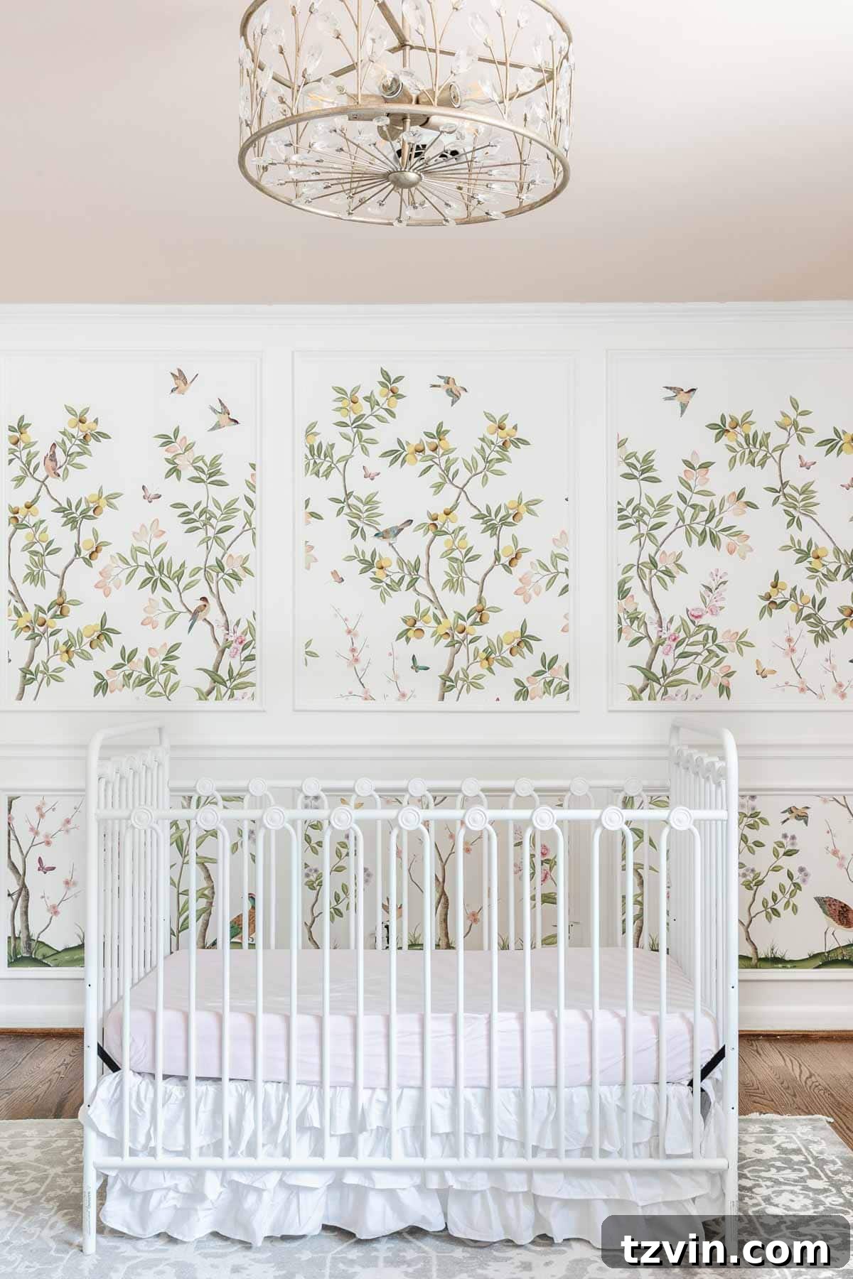 Create a Designer Look: Wallpapering Inside Picture Frame Molding 16 Wide shot of a girl's bedroom showcasing the beautiful chinoiserie wallpaper mural inside white picture frame molding, creating a whimsical and traditional aesthetic.