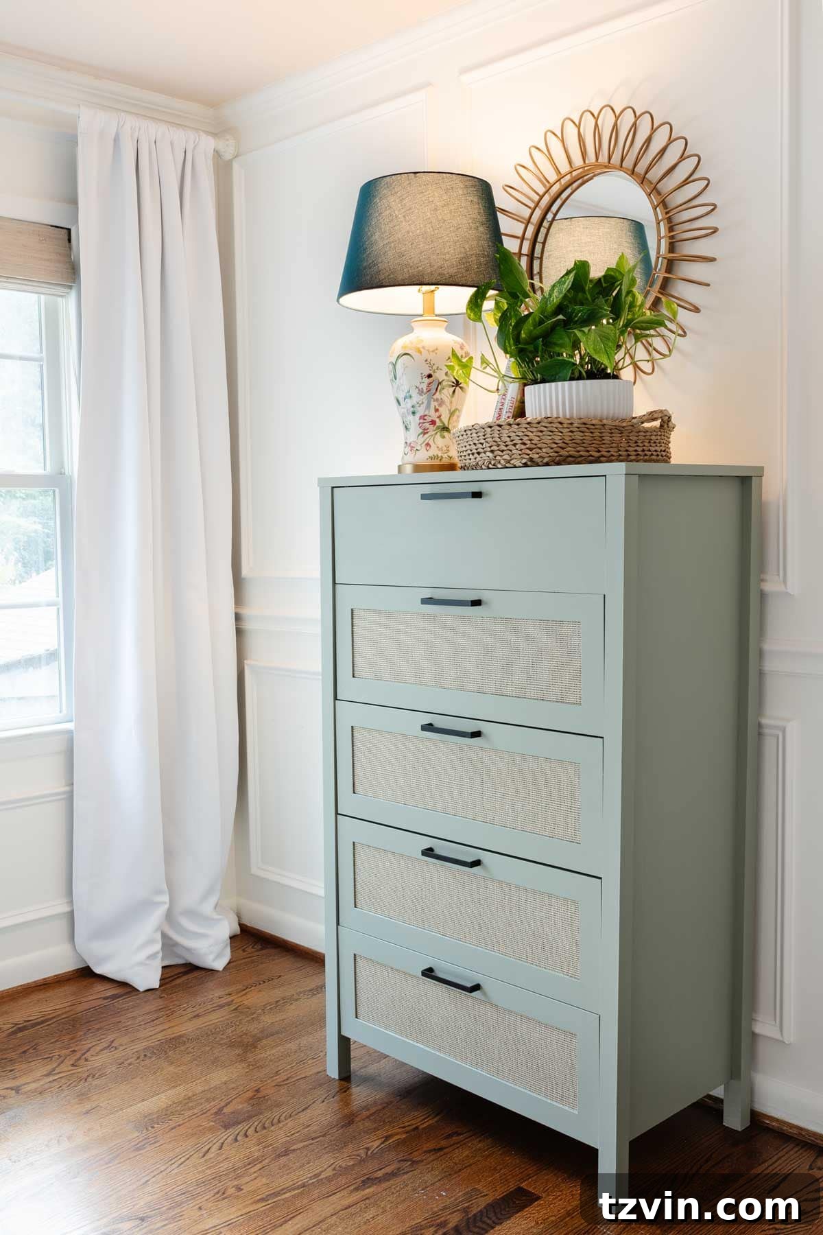 Beautiful green painted laminate dresser in a little girl's room, showcasing successful furniture makeover.