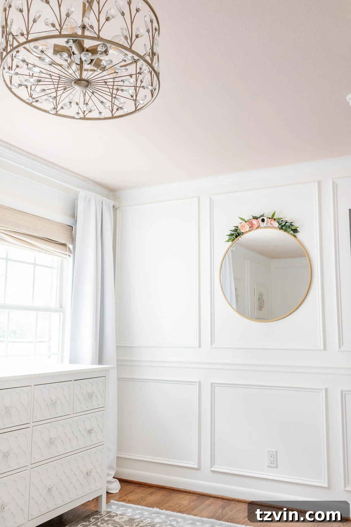 Cozy little girl's bedroom featuring a blush pink wall and a newly painted green dresser, part of a room refresh.