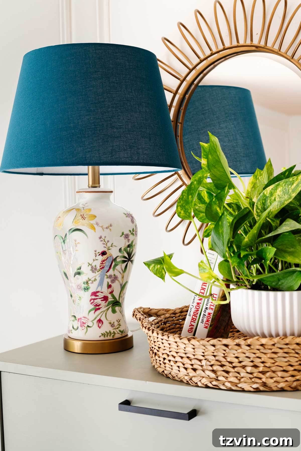 Elegant floral lamp on a dresser, perfectly complementing chinoiserie wallpaper in a child's bedroom.