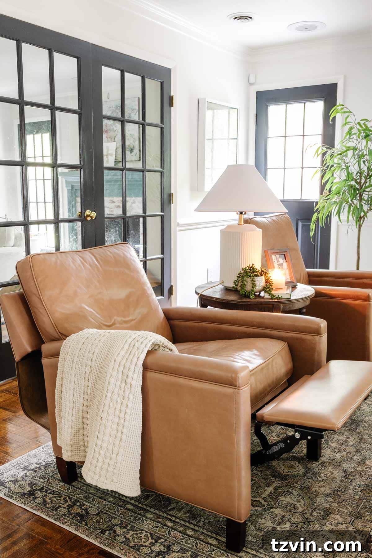 Pottery Barn Leather Recliner: Two Years Later, An Honest Appraisal 11 The stylish silhouette of a Pottery Barn Tyler square arm leather recliner in a modern living room setting.