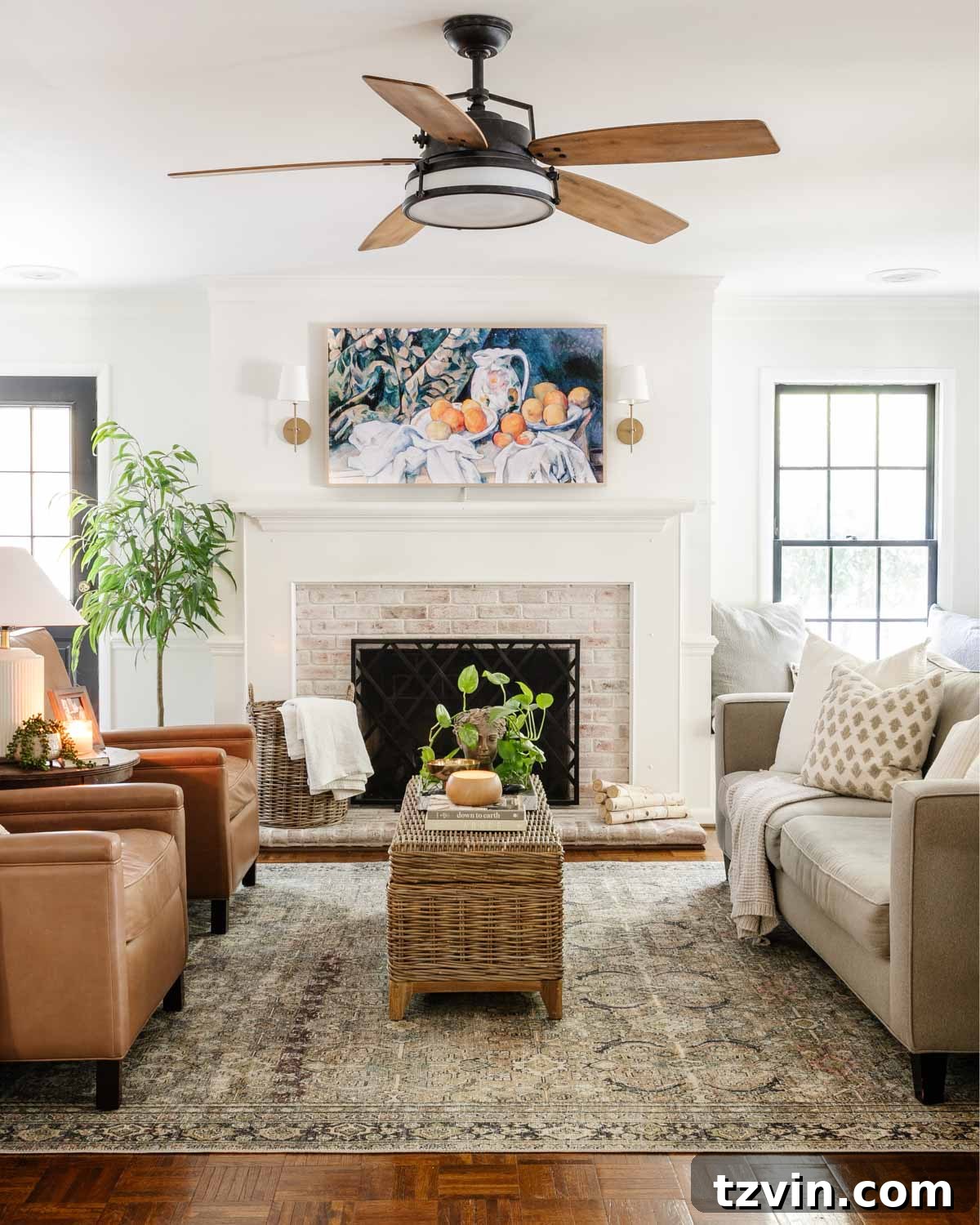 Pottery Barn Leather Recliner: Two Years Later, An Honest Appraisal 3 Stylish living room featuring two modern leather recliners from Pottery Barn, a coffee table, and decorative lighting.