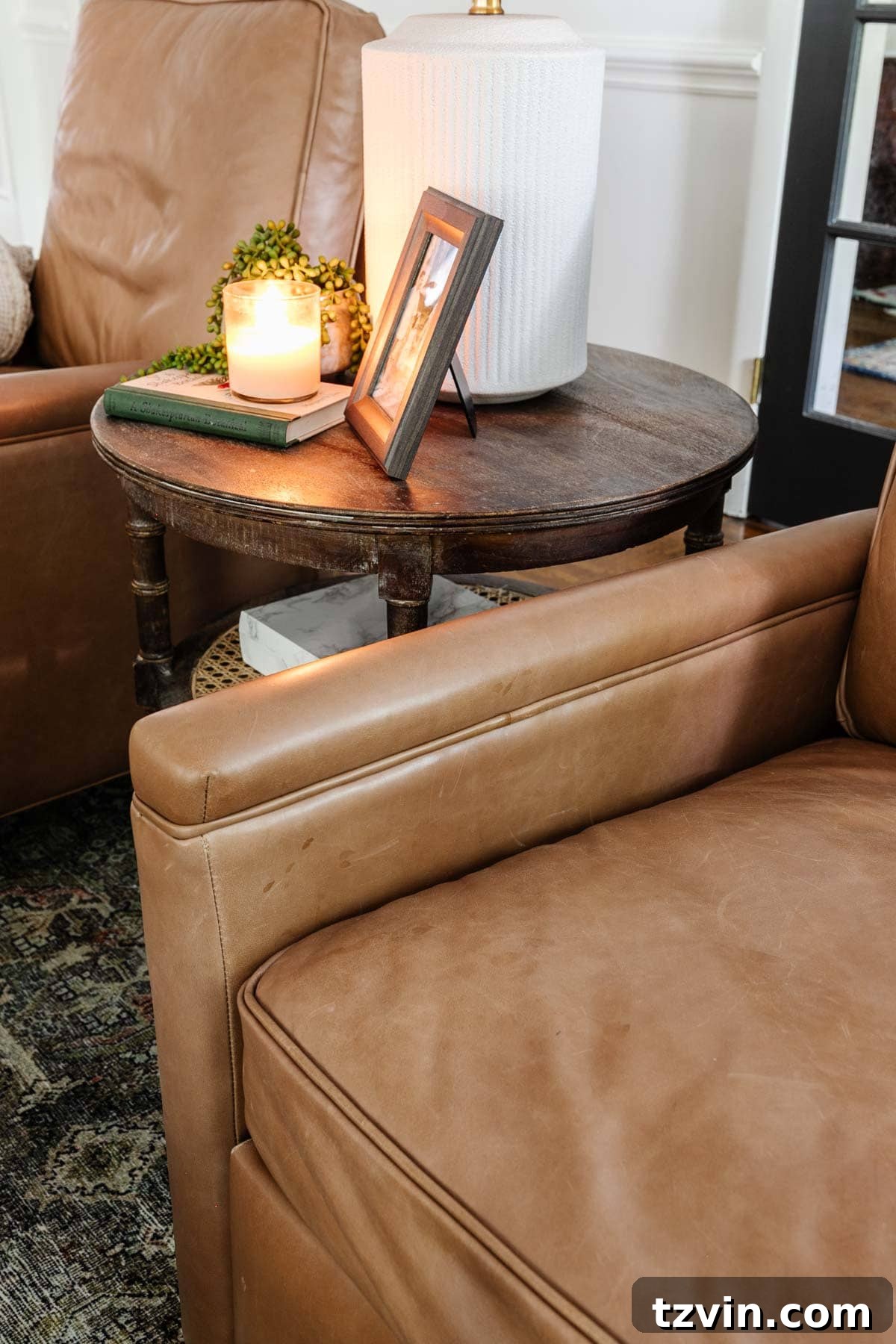 Pottery Barn Leather Recliner: Two Years Later, An Honest Appraisal 9 Close-up showing the natural leather patina and some wear on a Pottery Barn recliner, reflecting its real-world use.