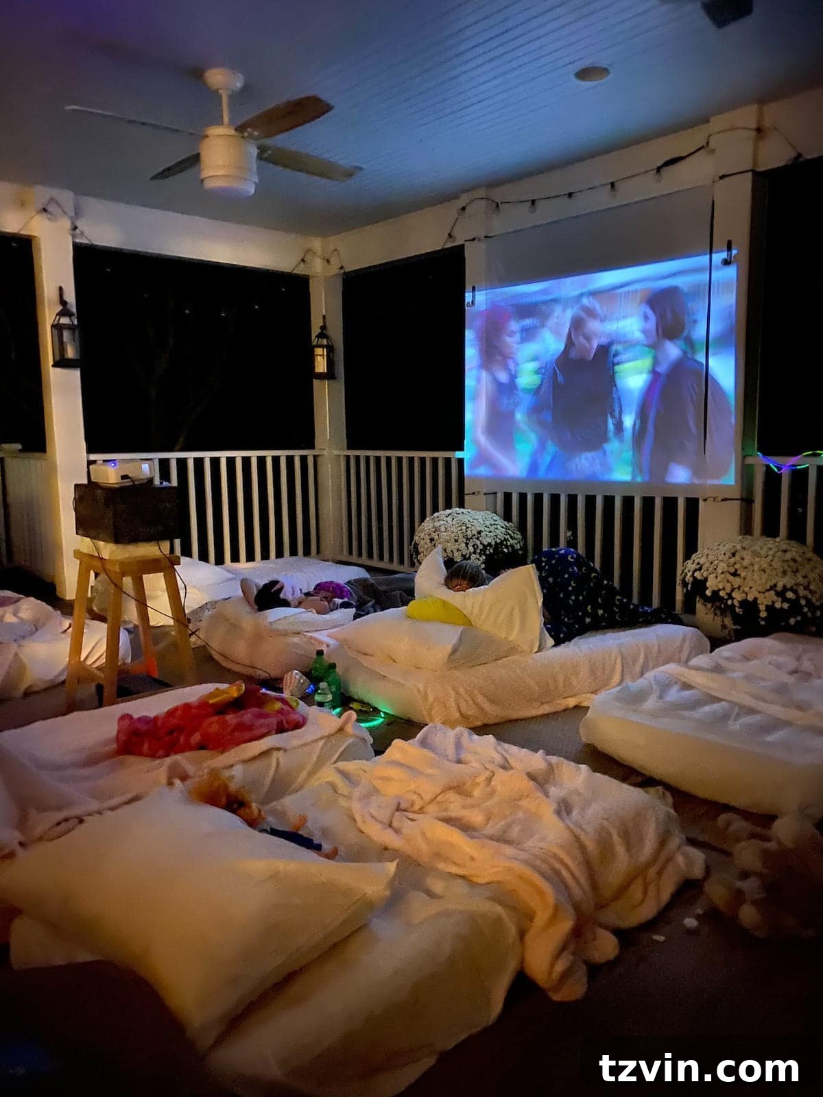 Backyard Blockbuster: Epic Movie Nights Without Breaking the Bank 15 outside movie night set up on a back porch for a birthday sleepover party