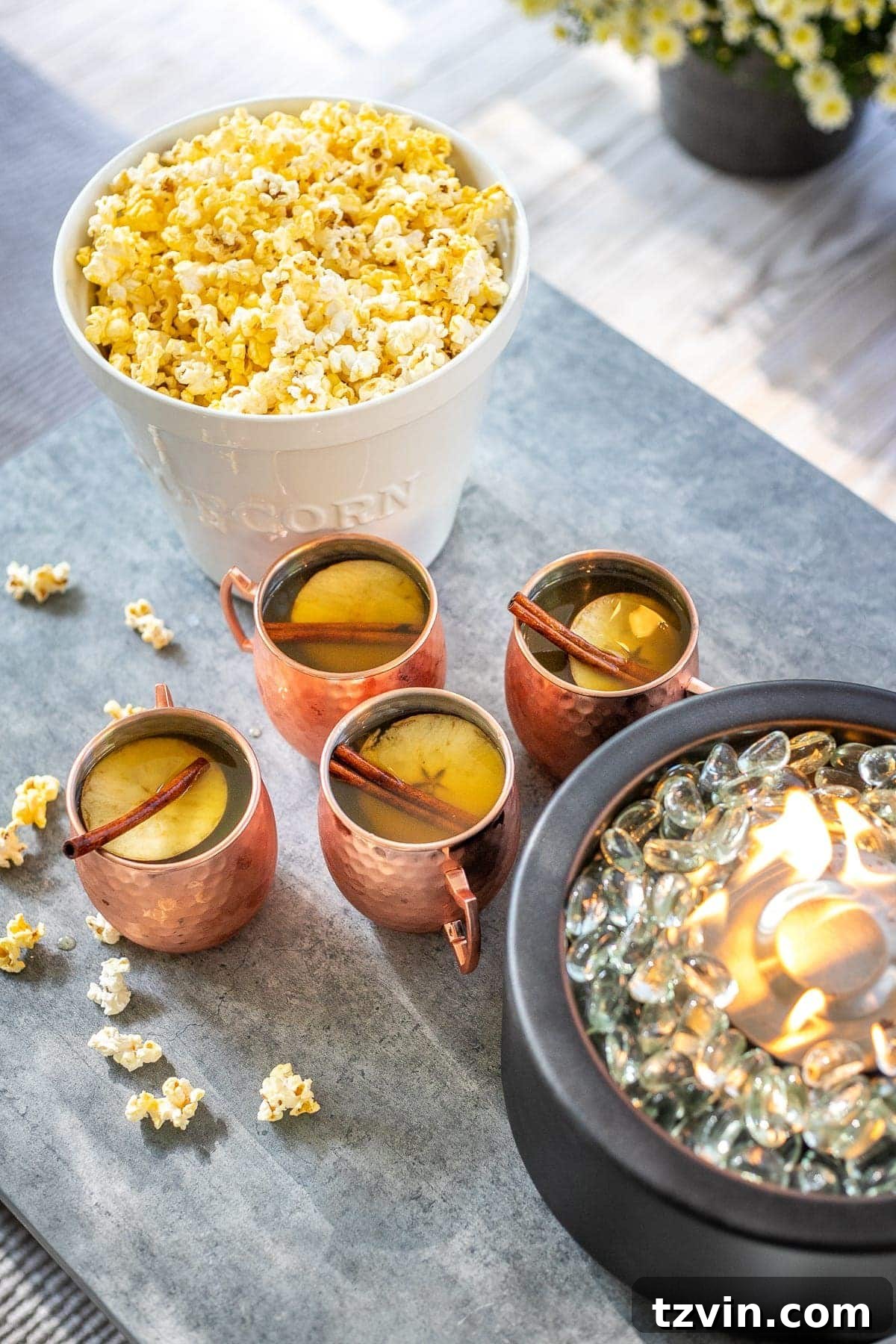 Backyard Blockbuster: Epic Movie Nights Without Breaking the Bank 18 bucket of popcorn and copper mugs of apple cider