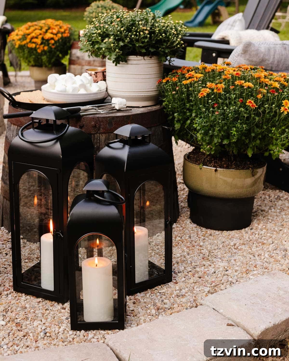 Ignite Autumn Nights: 8 Fire Pit Decor Ideas for Your Backyard 13 Fire pit ideas: enhancing ambiance with black lanterns and candlelight for evening gatherings