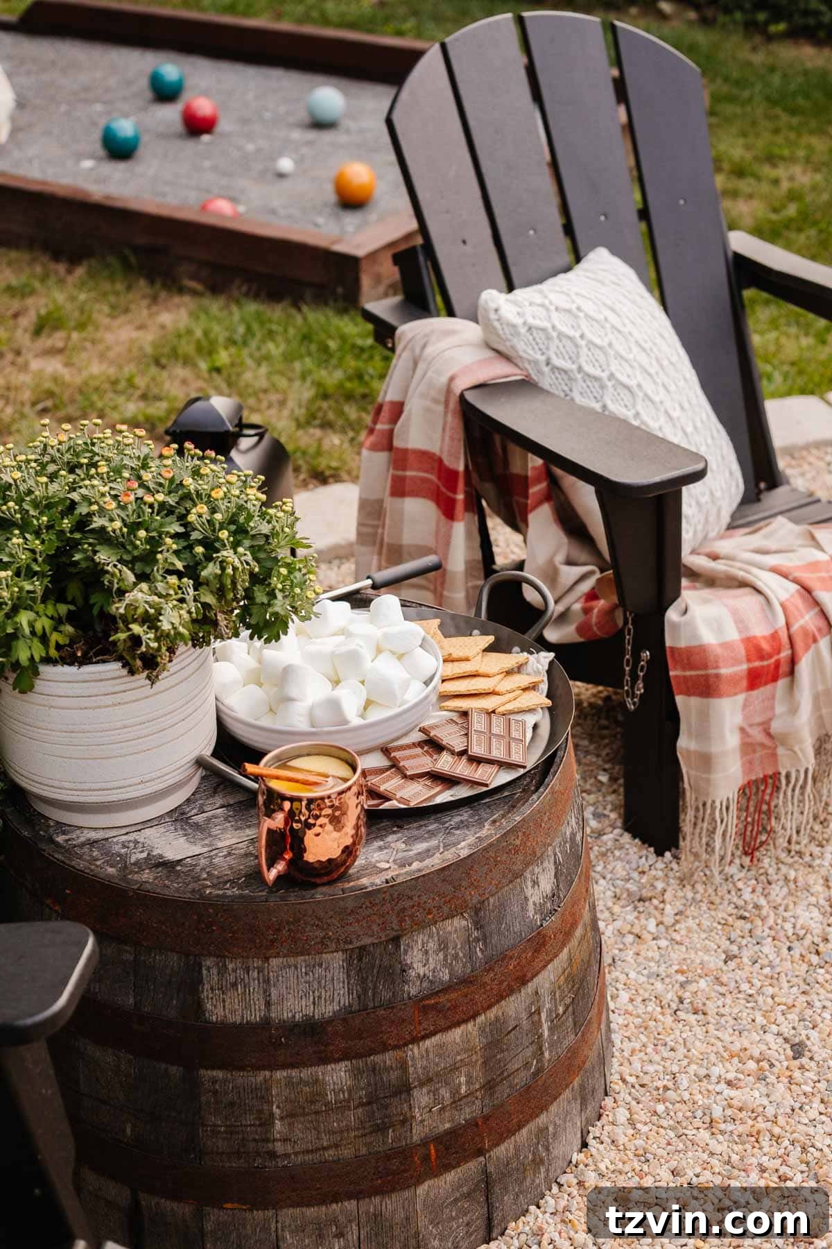 Ignite Autumn Nights: 8 Fire Pit Decor Ideas for Your Backyard 9 Fire pit ideas: a delightful s'mores station set up for a backyard party