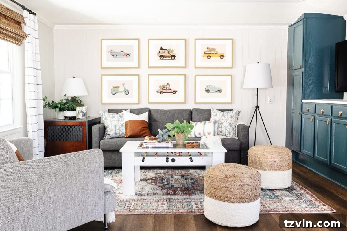 Designers' Go-To Off-White Paint Shades 13 Romabio Feather applied in a cozy rec room