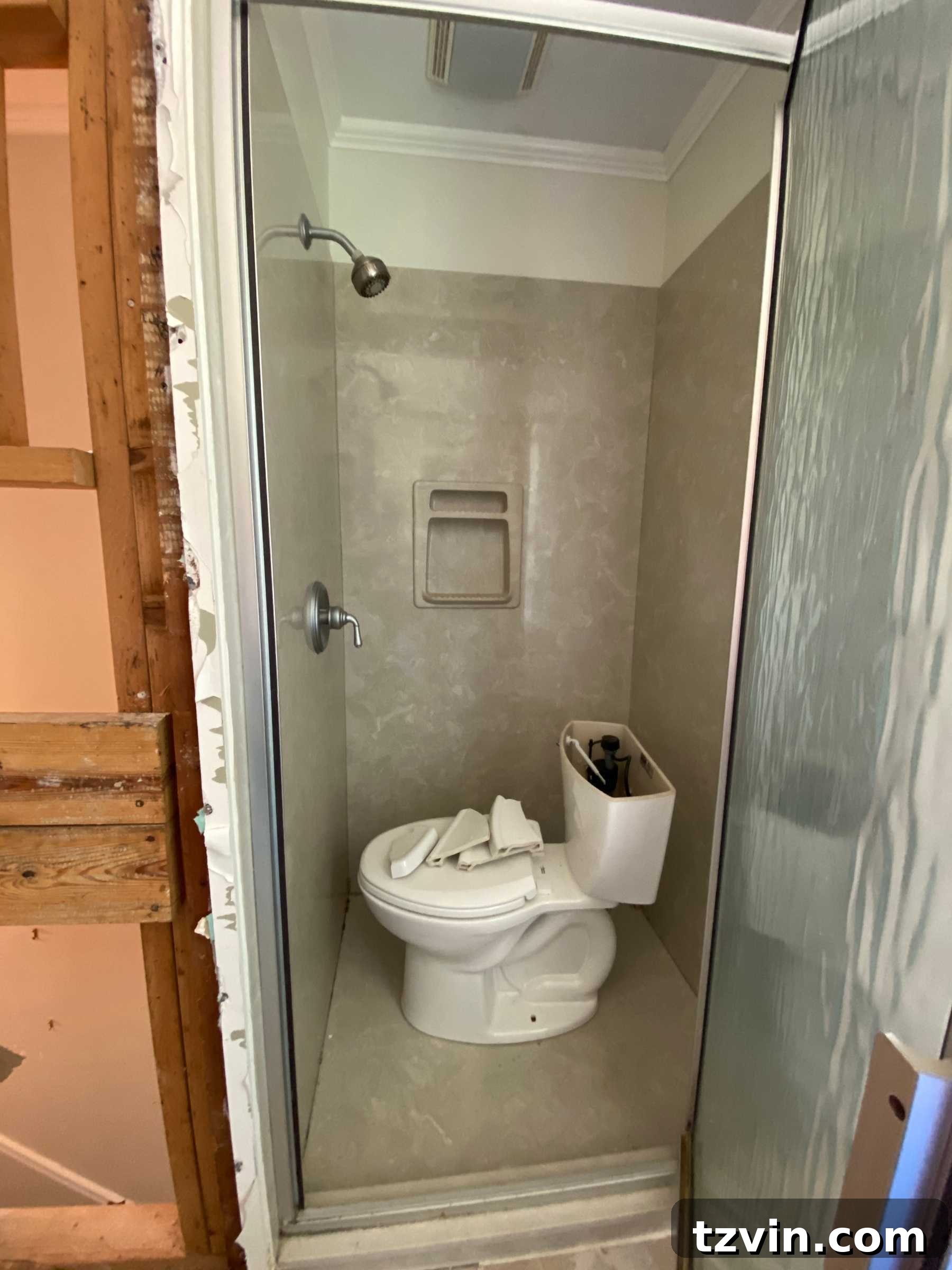 Our Faux Marble Herringbone Shower Transformation 4 dated 80s beige shower surround before renovation