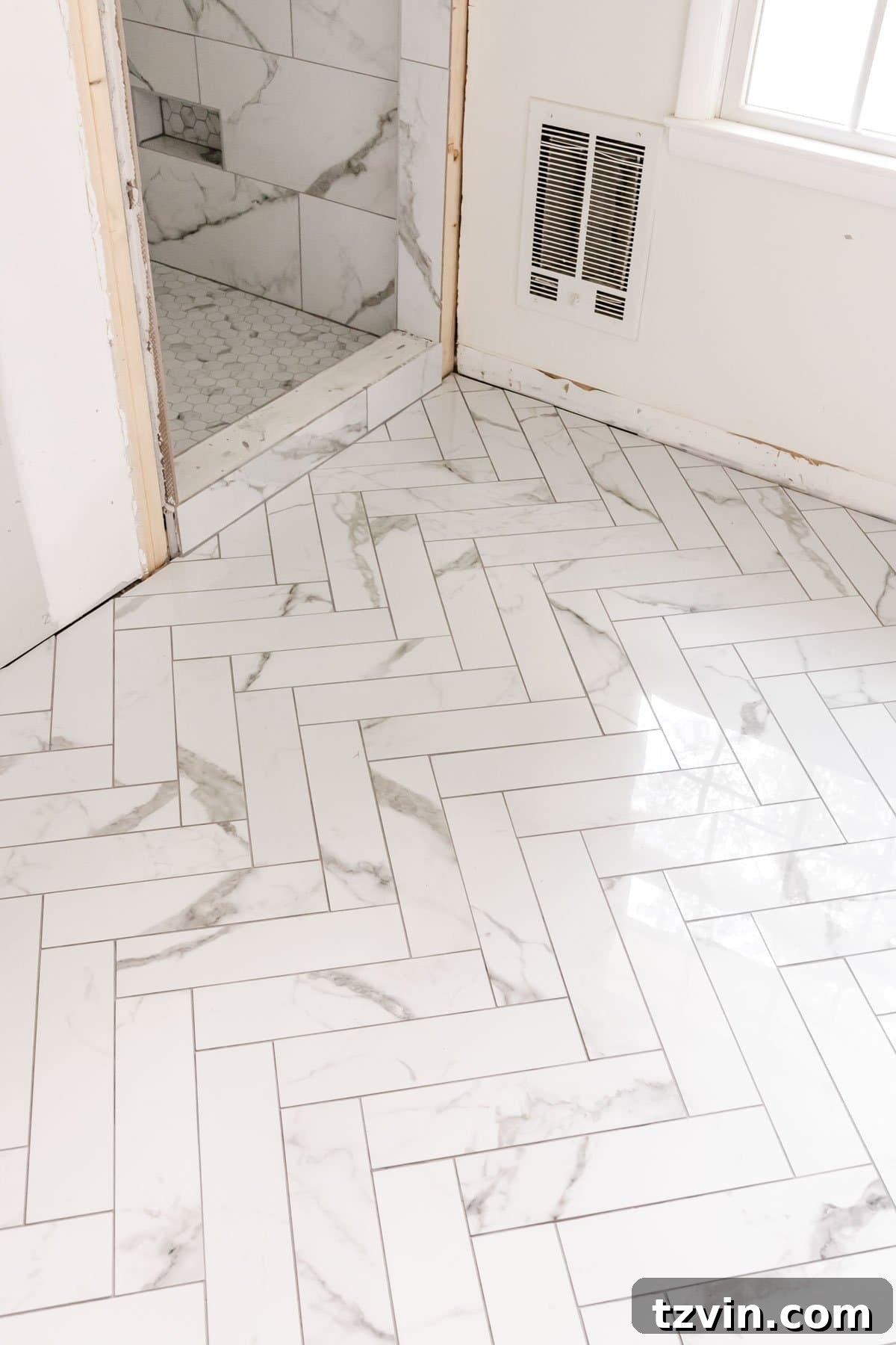 Our Faux Marble Herringbone Shower Transformation 7 sophisticated faux marble herringbone floor extending into the shower area