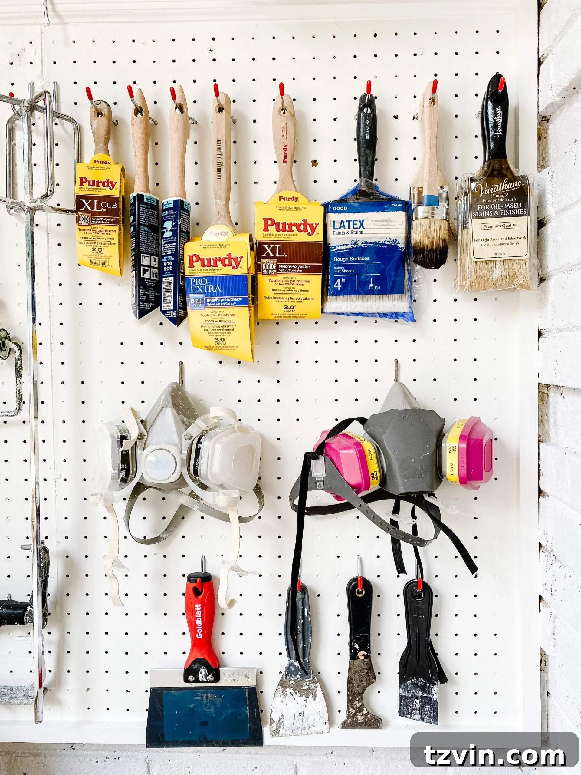 Paint Storage Perfection: Closet Organization Hacks 11 pegboard hooks with paint brushes