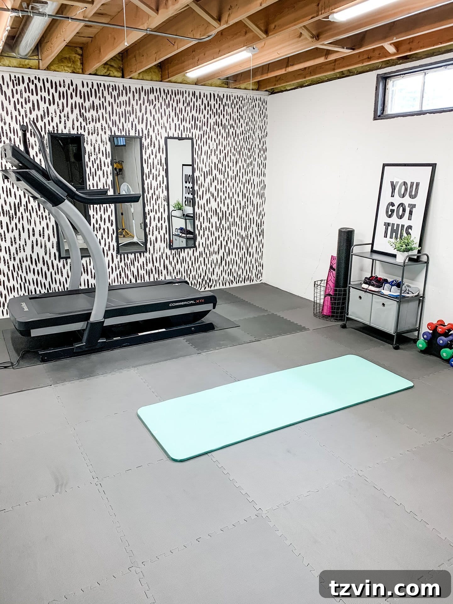 Smart Home Gym Solutions for Basements Garages and Sheds 12 home gym with a brushstroke accent wall in a basement setting
