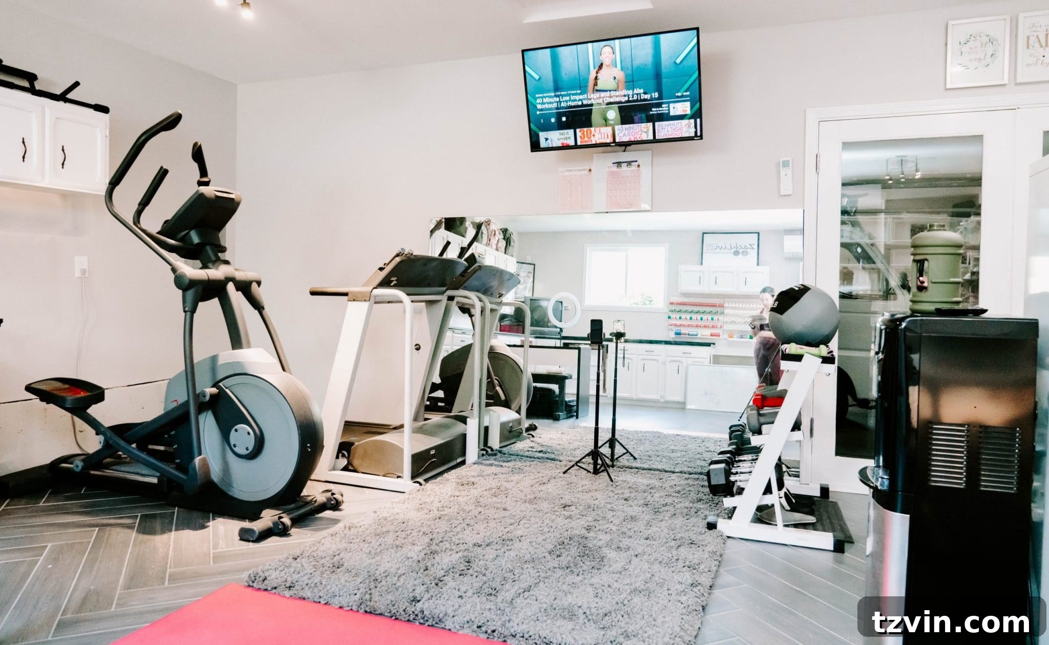 Smart Home Gym Solutions for Basements Garages and Sheds 10 workout room with TV, large mirror, and comfortable rug
