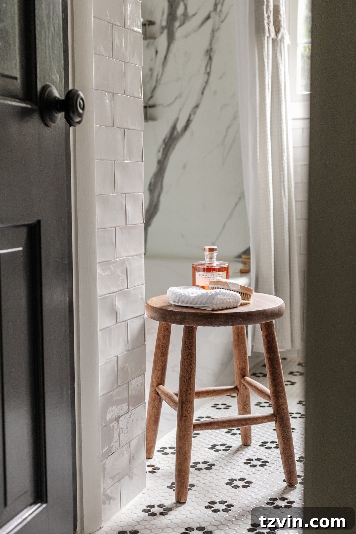 Monochrome Bathroom Makeover for Timeless Style 17 bathroom stool with toiletries and black and white bathroom tile
