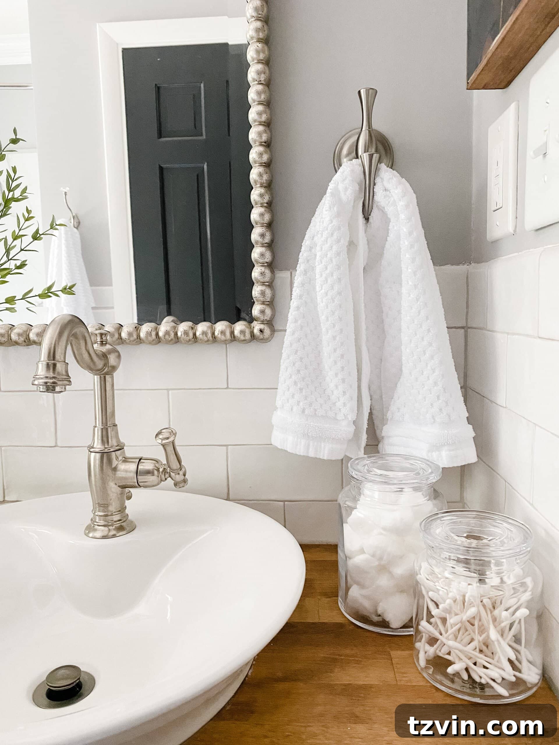 Monochrome Bathroom Makeover for Timeless Style 8 apothecary jar bathroom accessories