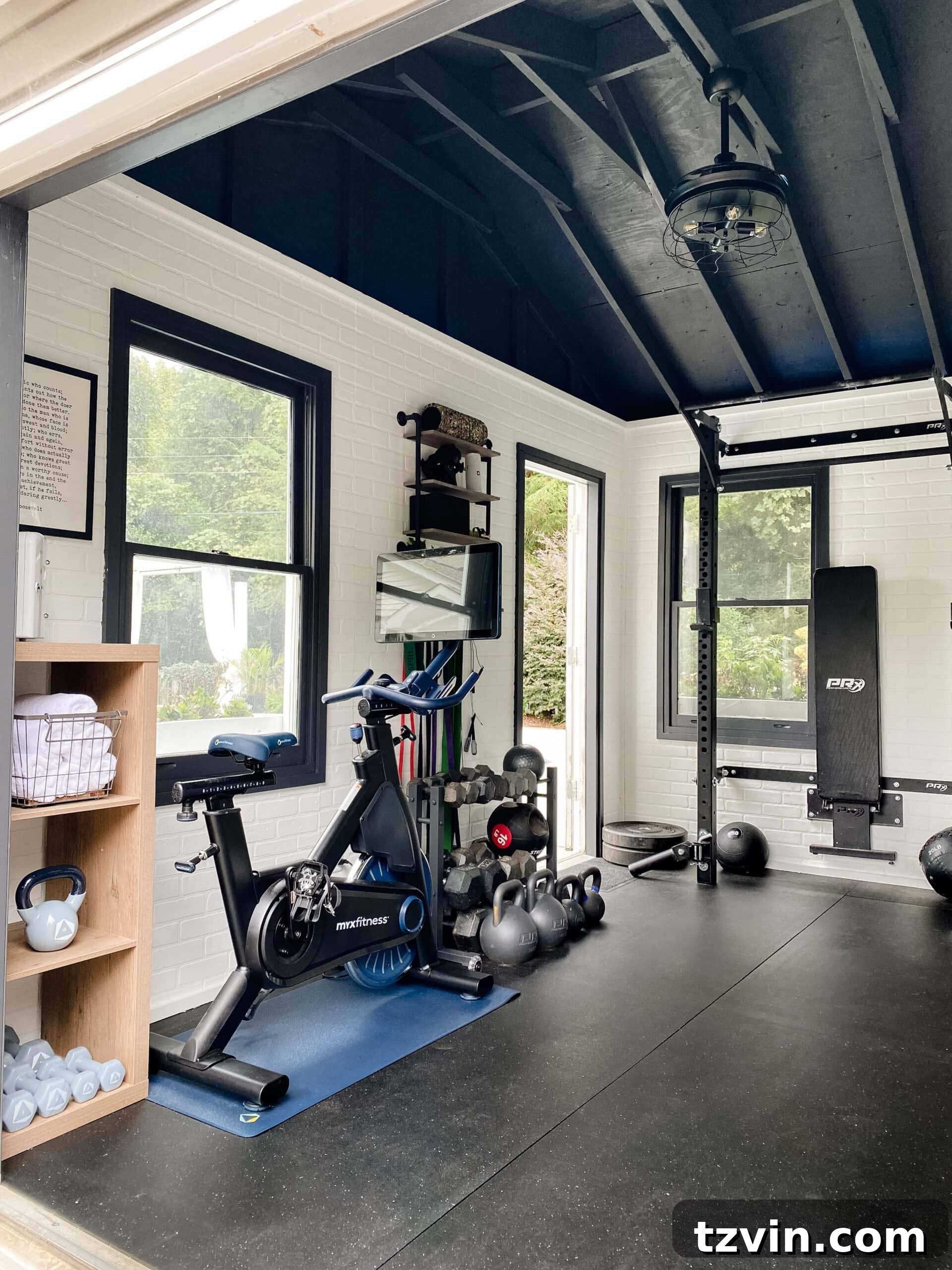 Shed Smart: Budget Home Gym Builds 4 at home gym shed with cardio bike and weight lifting area