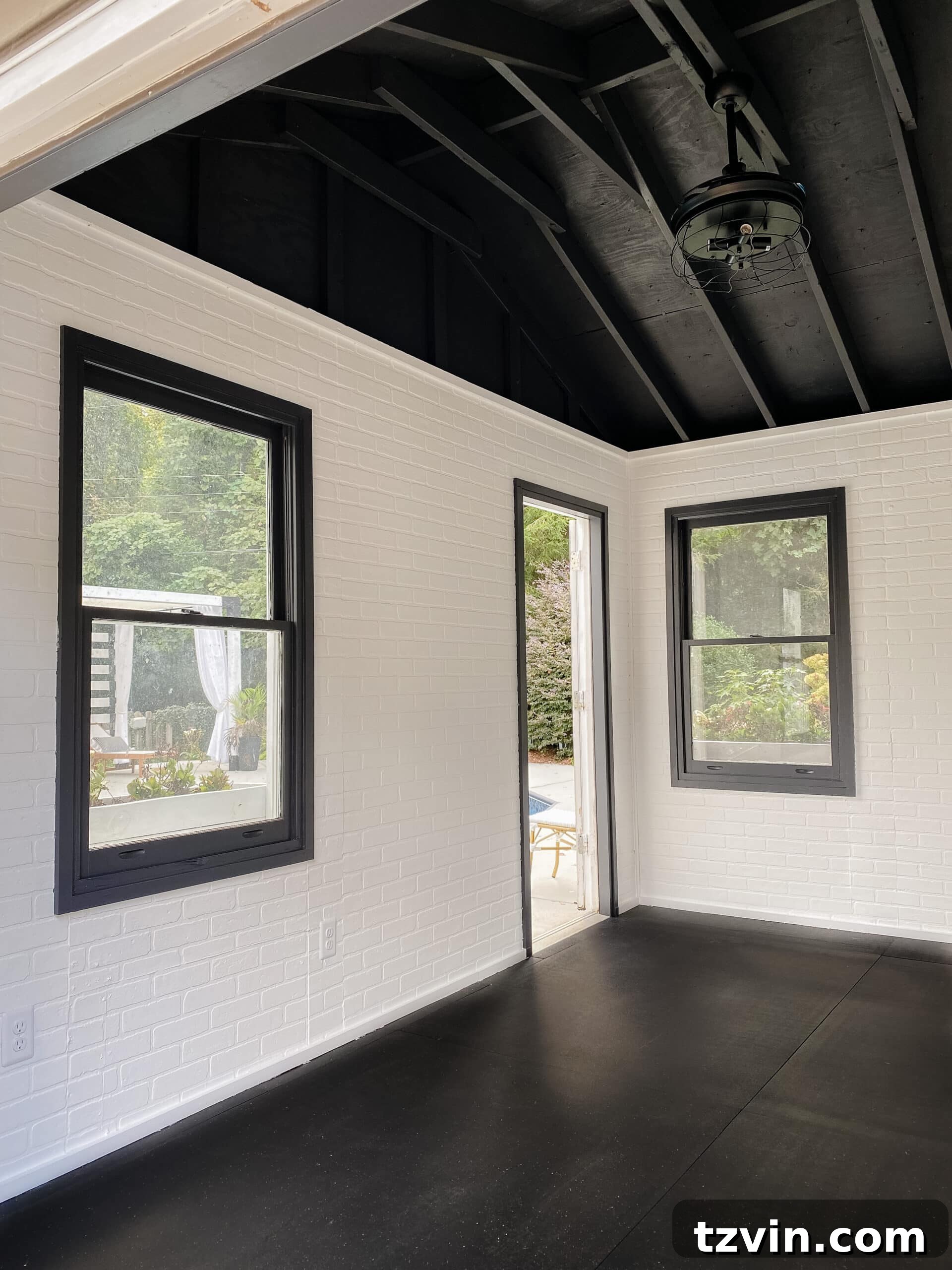 Grow Your Home Gym: A Budget-Smart, Step-by-Step Blueprint 2 empty home gym shed with white brick and black ceiling, showcasing potential