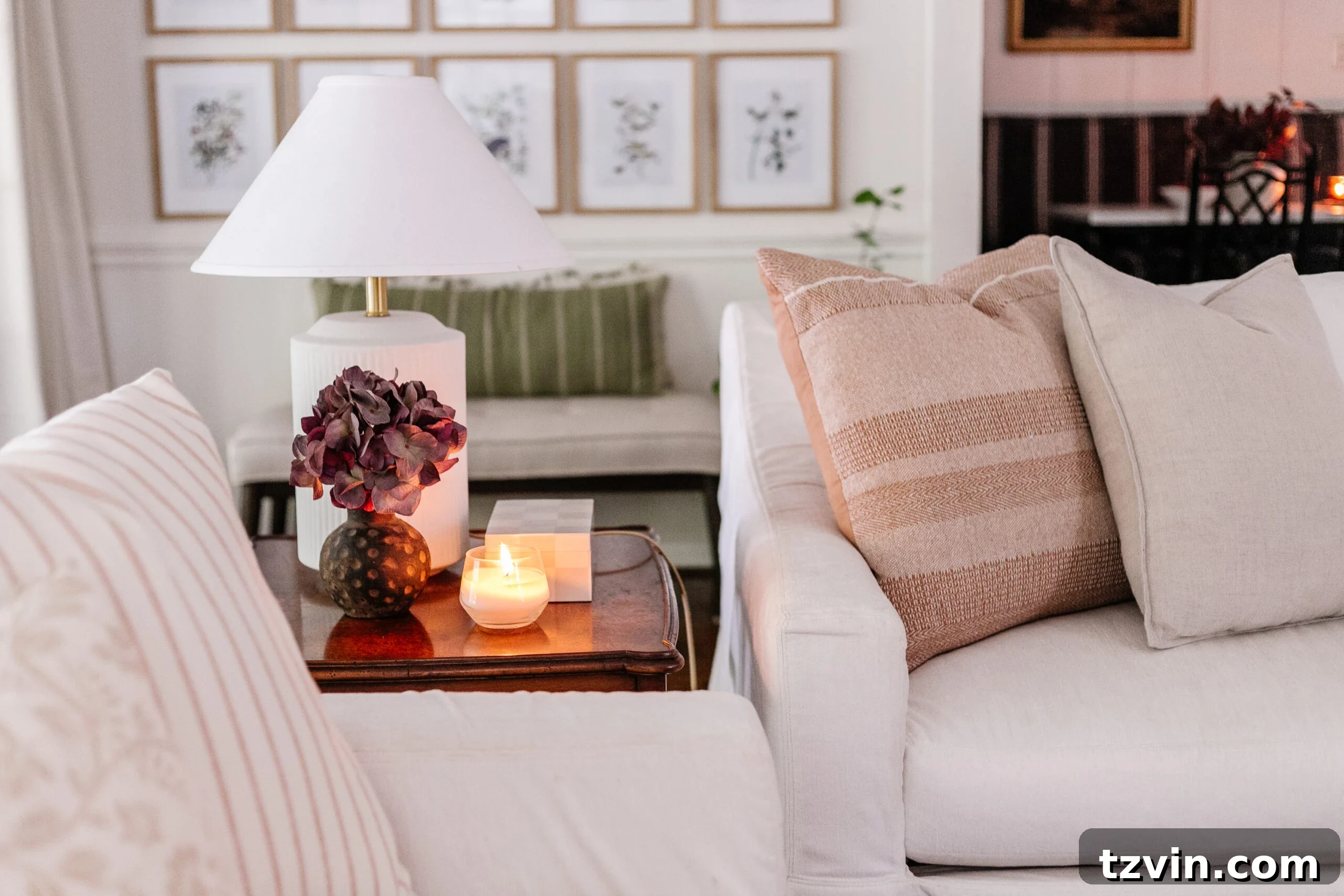 Stylish nesting end tables placed between white couches in a contemporary living room