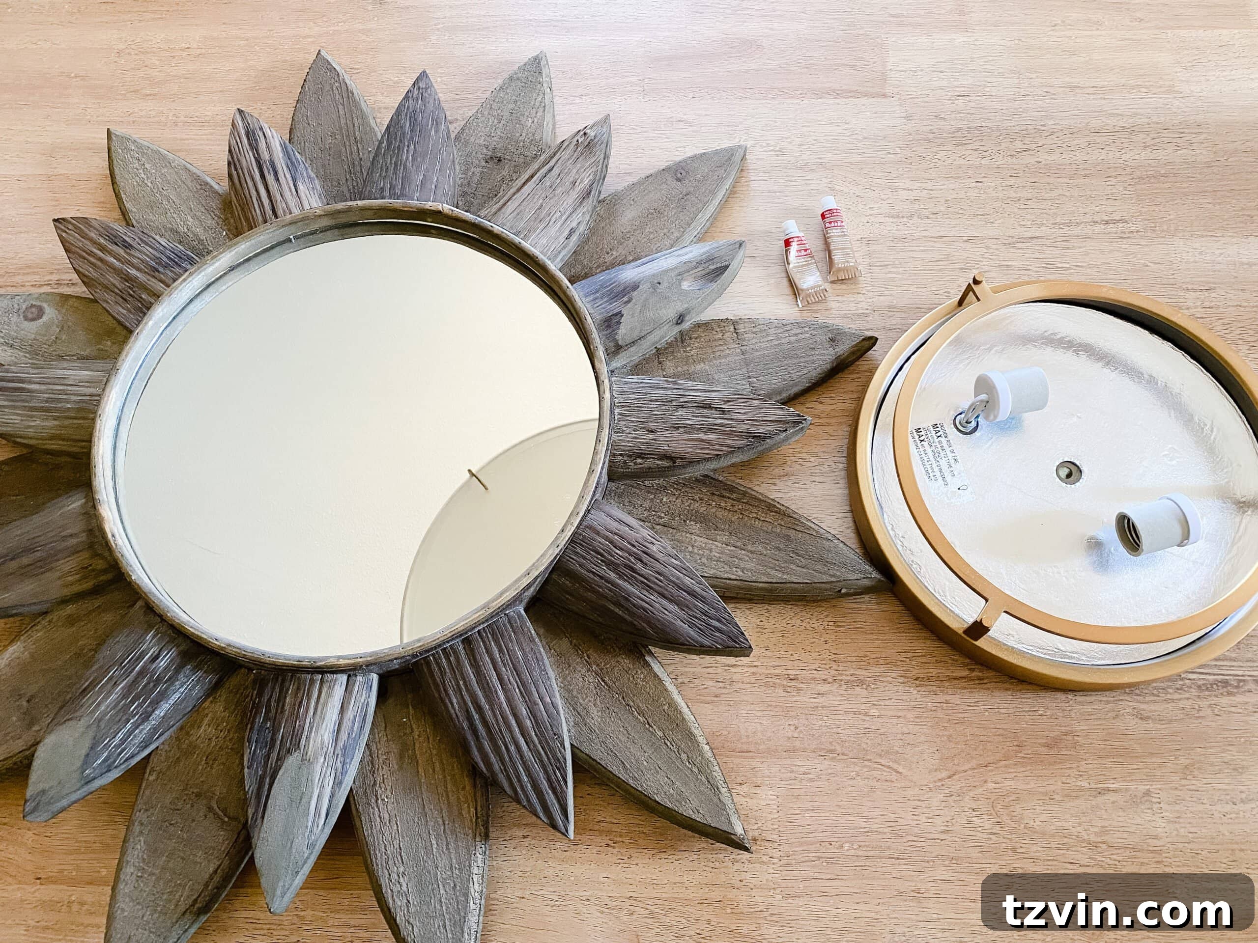 Sunburst Mirror Radiance: Your DIY Light Fixture 2 Statement-making DIY light fixture created by combining a sunburst mirror and a flush mount light
