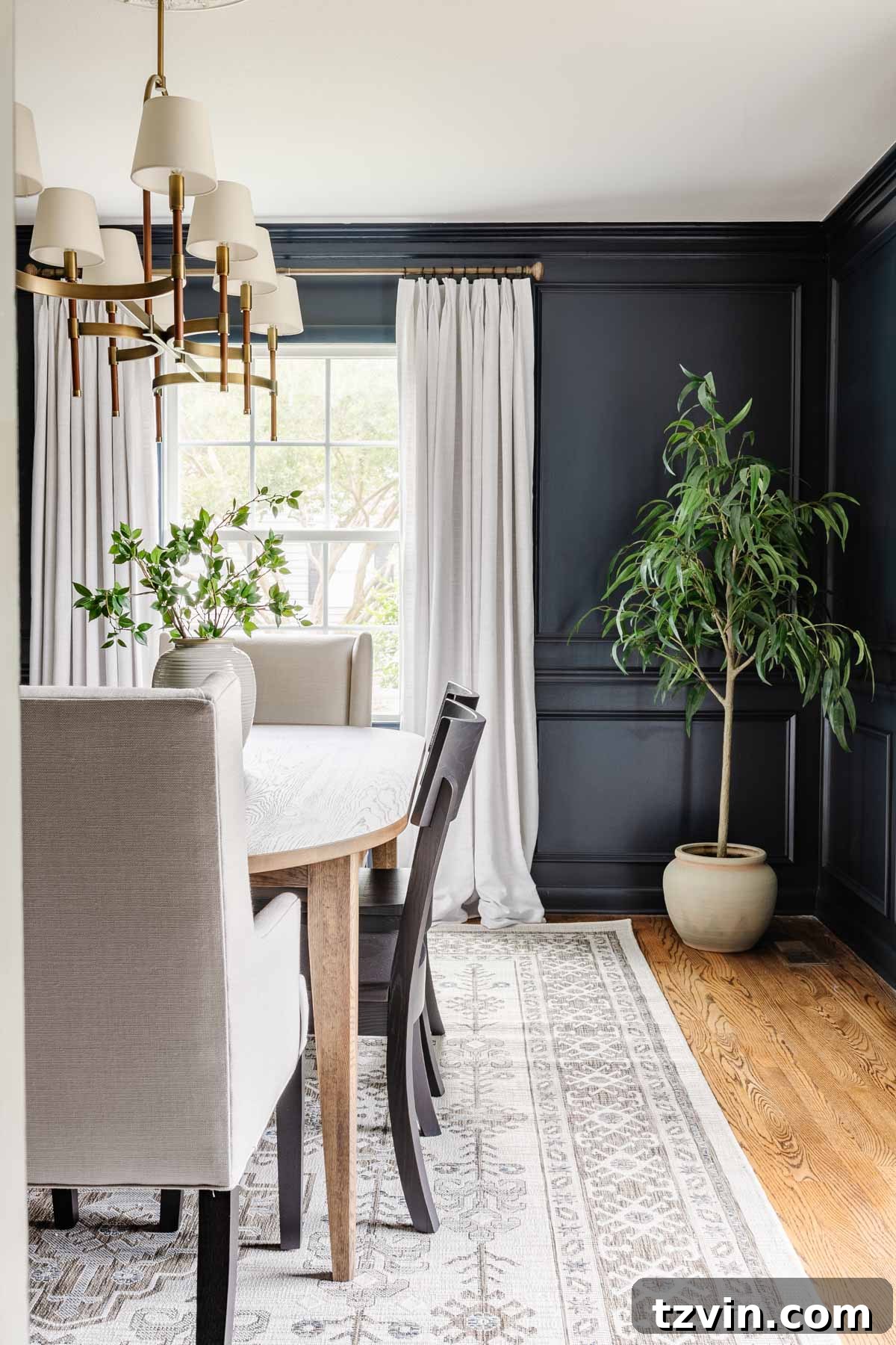 Spill-Proof Chic: 20 Must-Have Machine-Washable Rugs 5 A chic and practical dining room featuring a geometric Scandinavian-style indoor-outdoor washable rug, perfectly blending modern aesthetics with resilient functionality.
