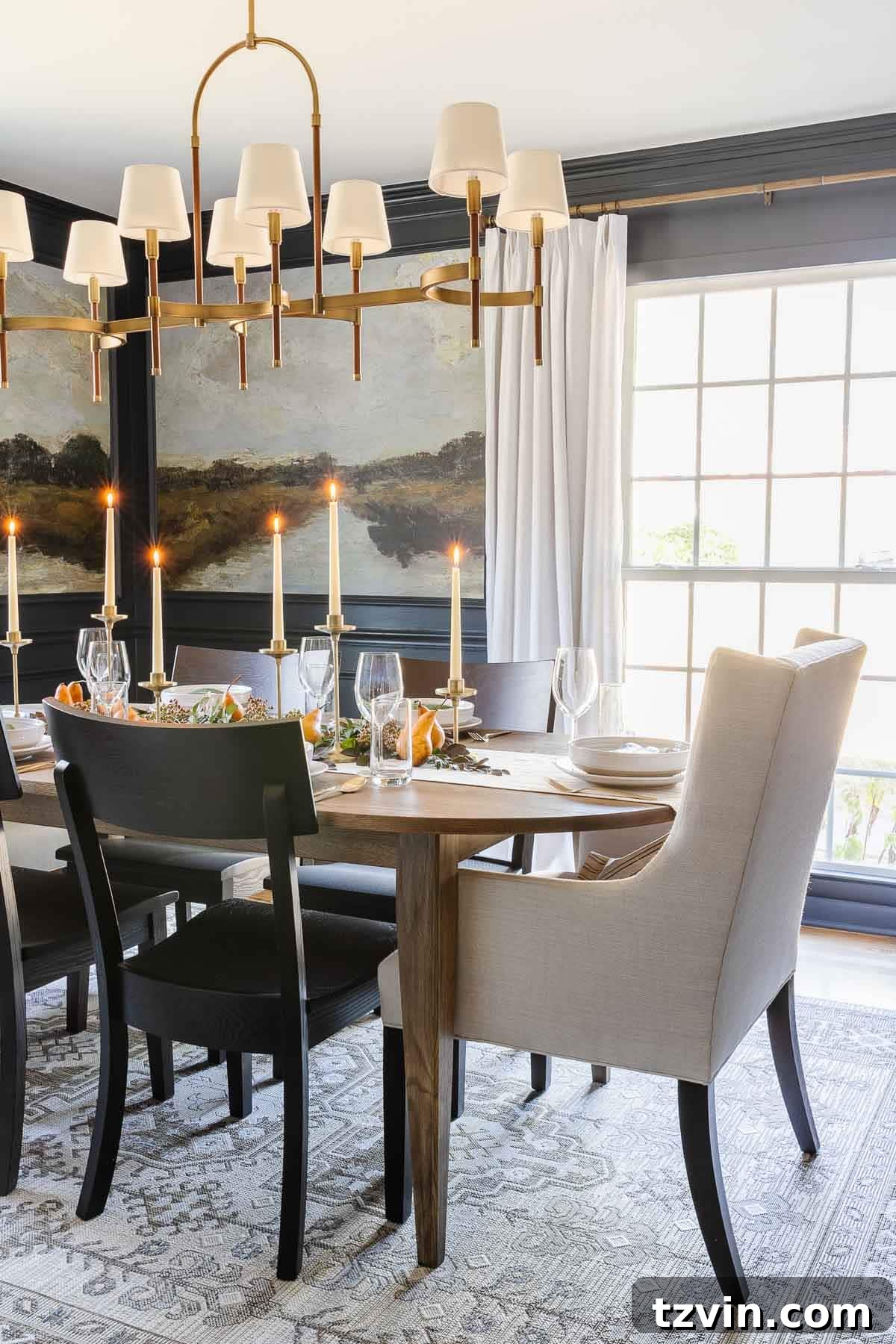 10-Minute Thanksgiving Table Makeover 11 Artful Thanksgiving centerpiece arrangement with natural foliage, pears, and candles, set against the elegant dining room backdrop.