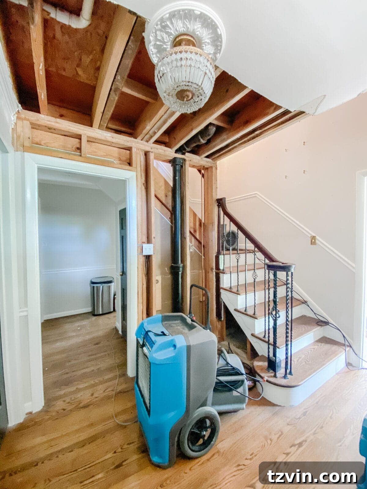 Foyer Fusion Classic Meets Contemporary 6 Photo depicting water damage mitigation in the foyer during renovation