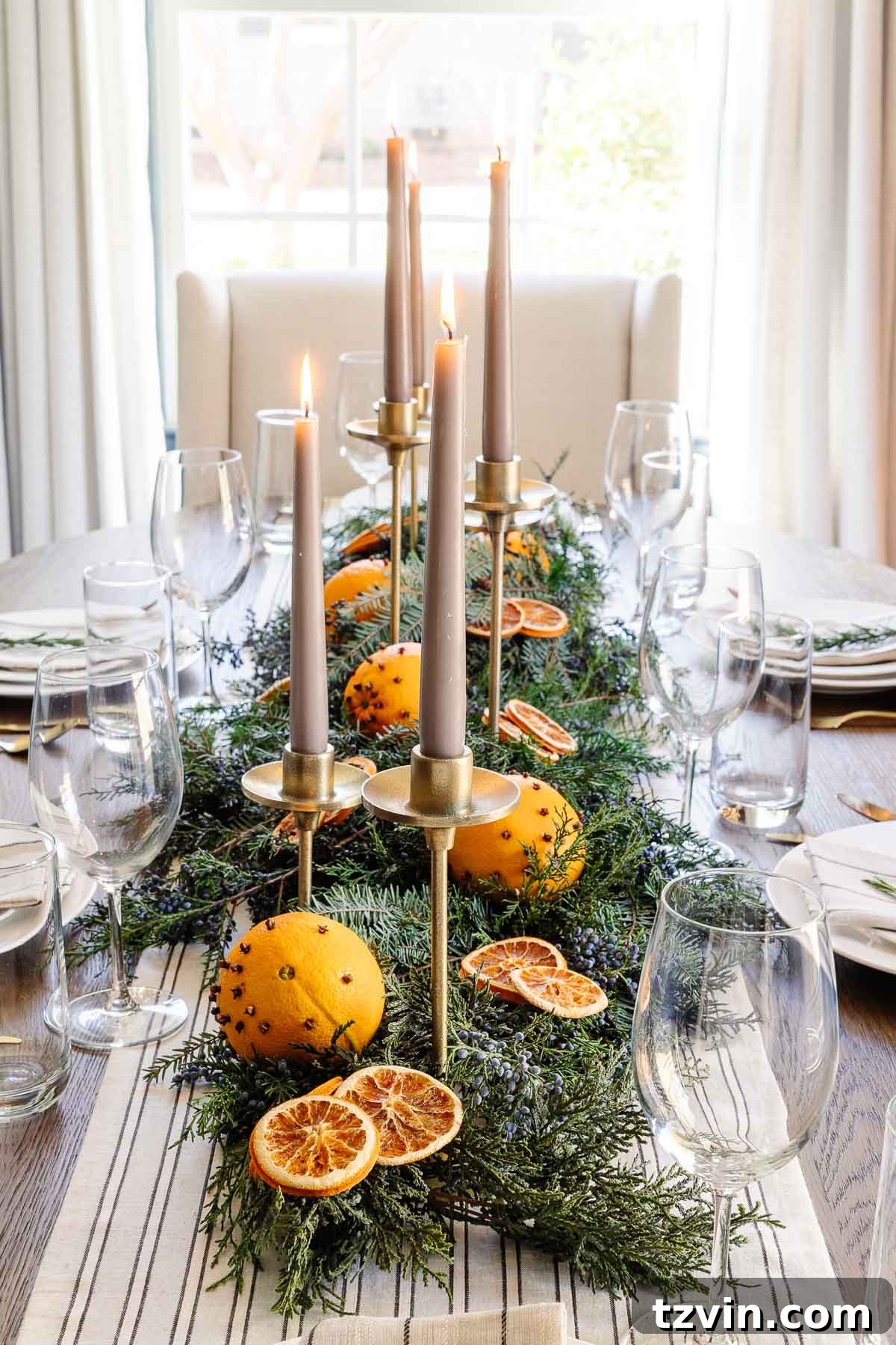 dried orange, evergreen, and juniper berry simple Christmas table centerpiece