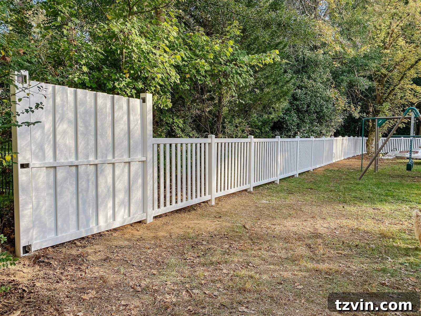 white vinyl fence installation with Ply Gem in a backyard