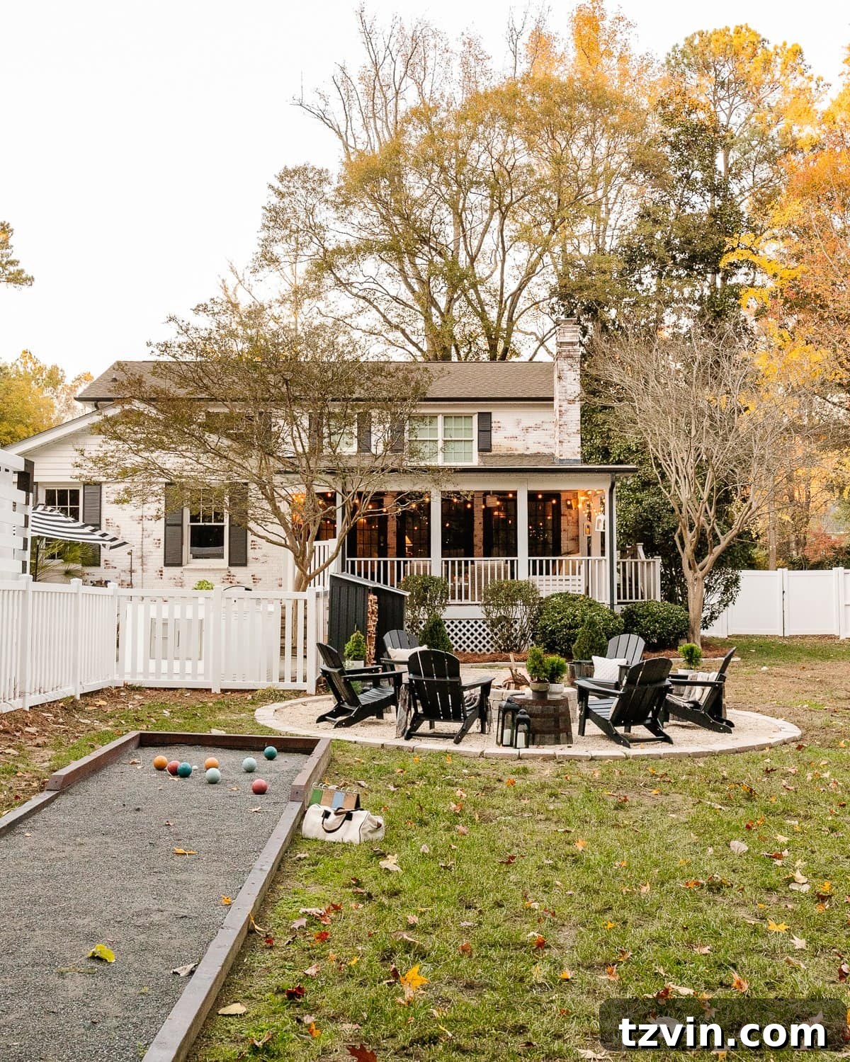 What We Really Paid for Our Backyard Oasis 22 backyard bocce ball court with string lights and lanterns