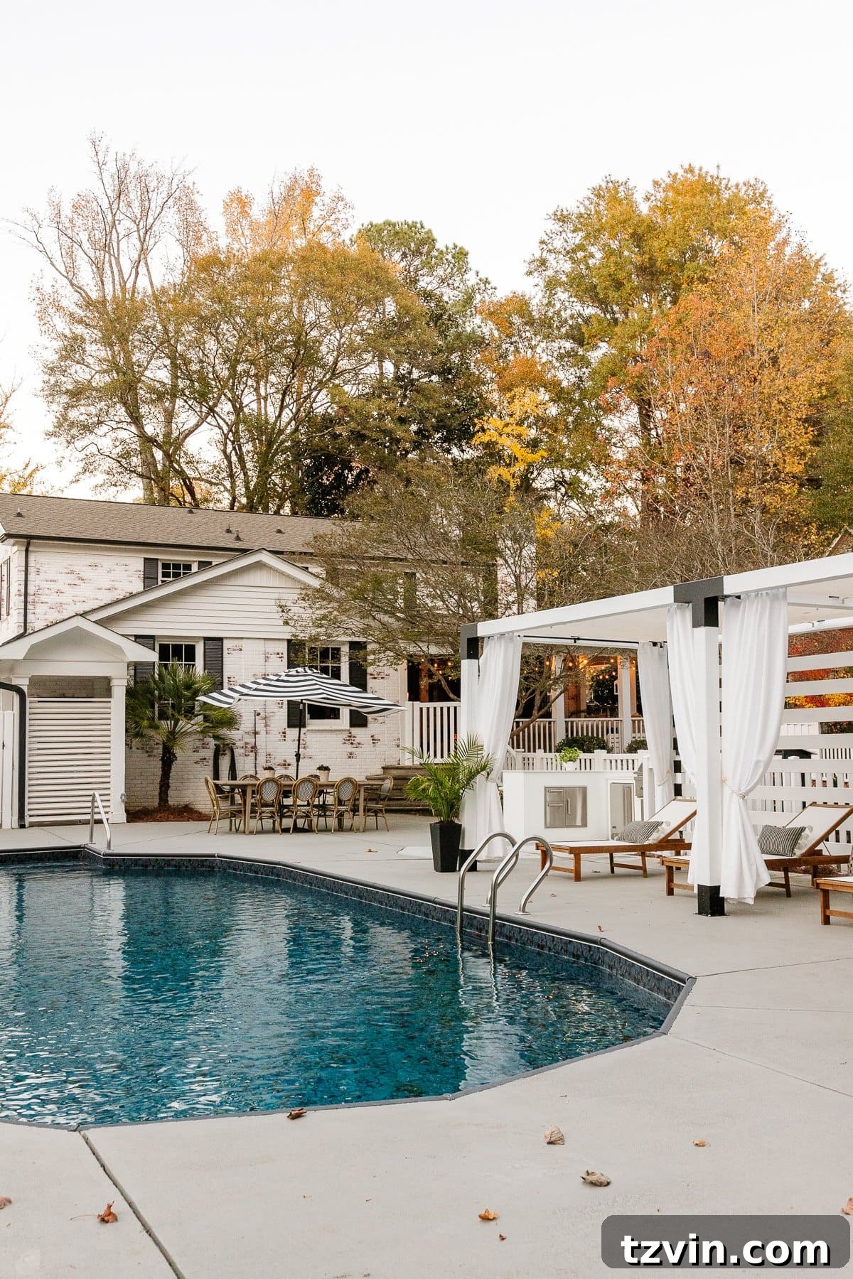 What We Really Paid for Our Backyard Oasis 31 painted concrete pool deck with swimming pool and cabana