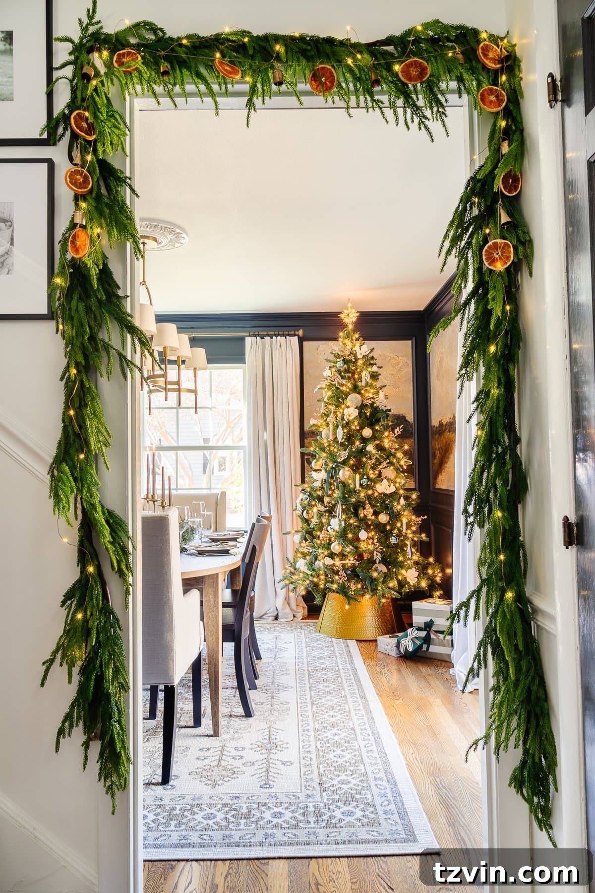 Craft Your Own Beautiful Dried Orange Garland 2 Beautiful dried orange garland adorning festive greenery around a doorway, creating a charming Christmas entrance.