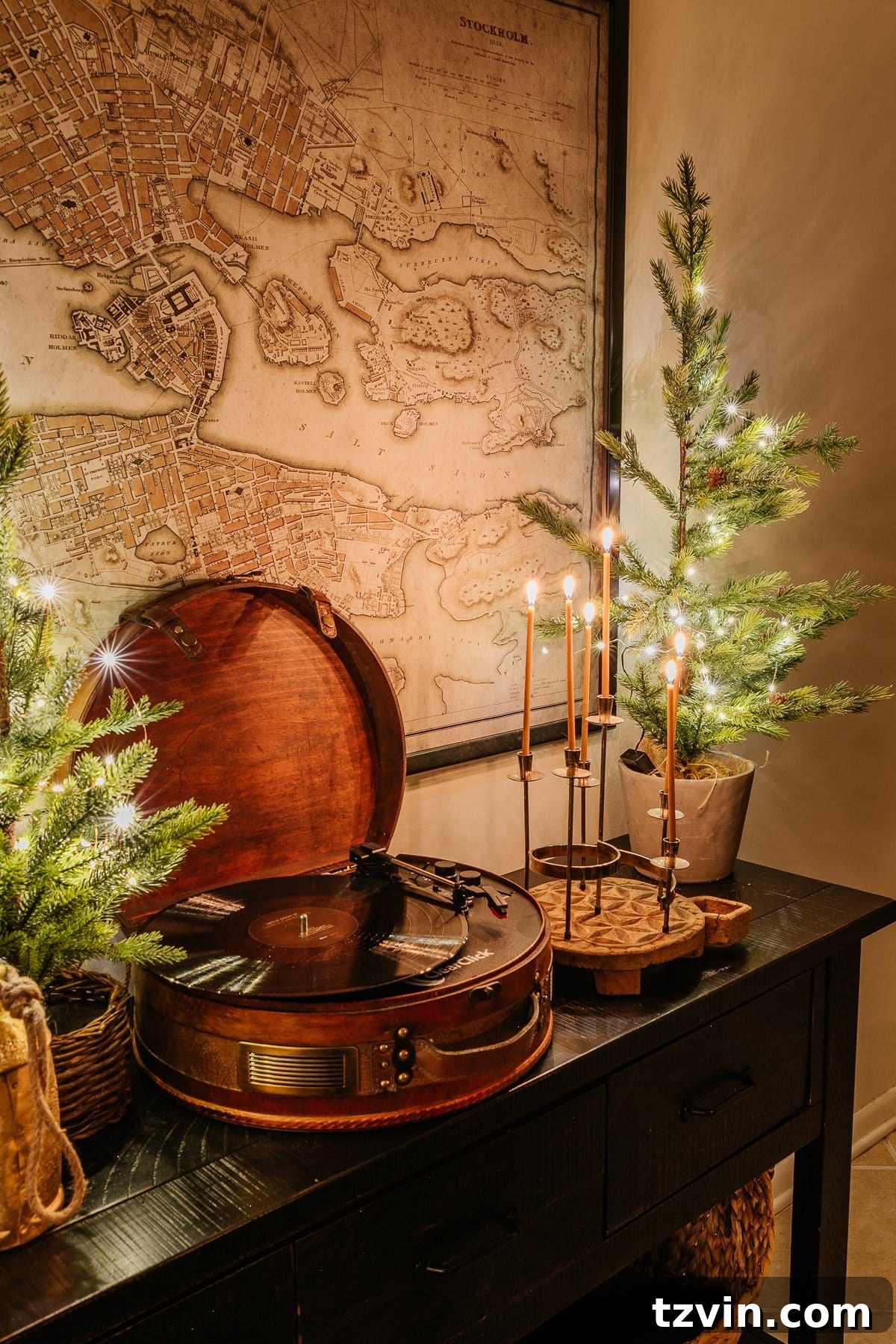 Holiday Glow Home Showcase 25 A console table adorned with candlelight Christmas decor, adding a touch of elegance and warmth to the entryway.