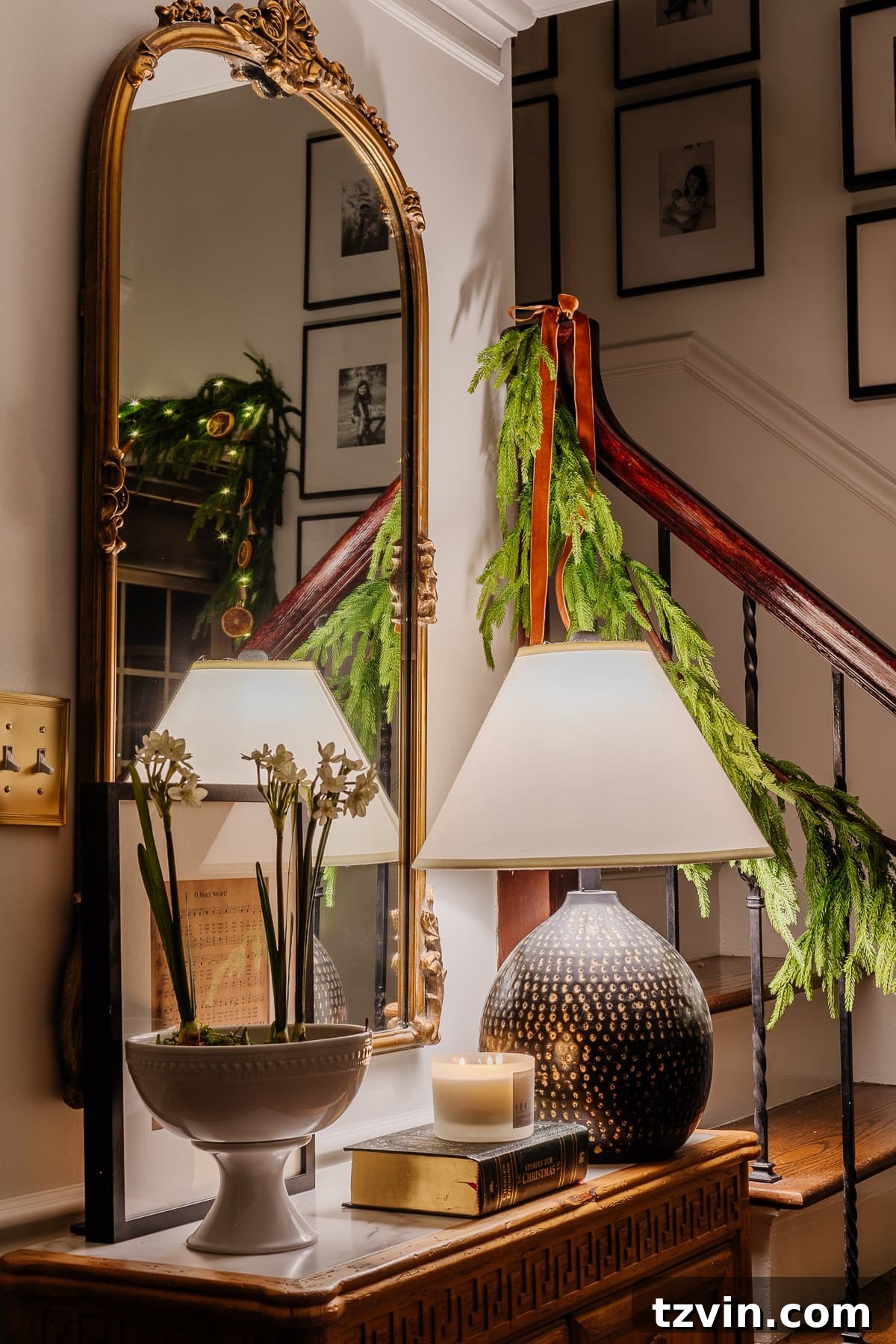 Holiday Glow Home Showcase 5 A different perspective of the foyer at night, showcasing Christmas decorations bathed in candlelight, creating a tranquil scene.