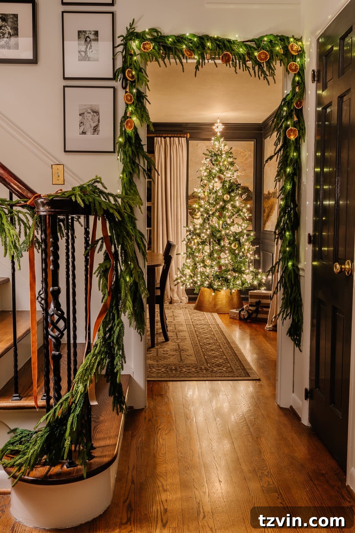 Holiday Glow Home Showcase 7 A cozy doorway view from the stairs leading into the Christmas-decorated dining room, softly lit by candlelight.
