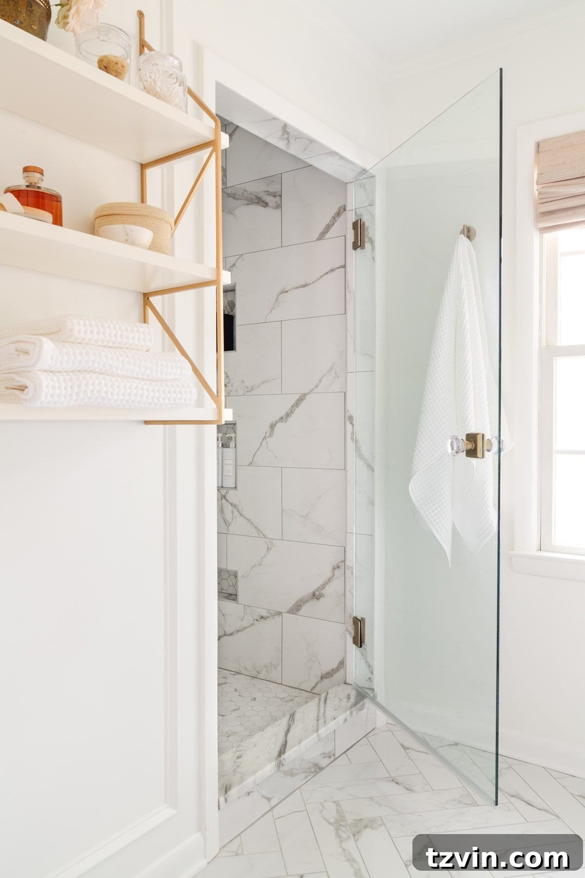 Bathroom renovation cost after - shower with ceramic marble look tile and frameless glass door