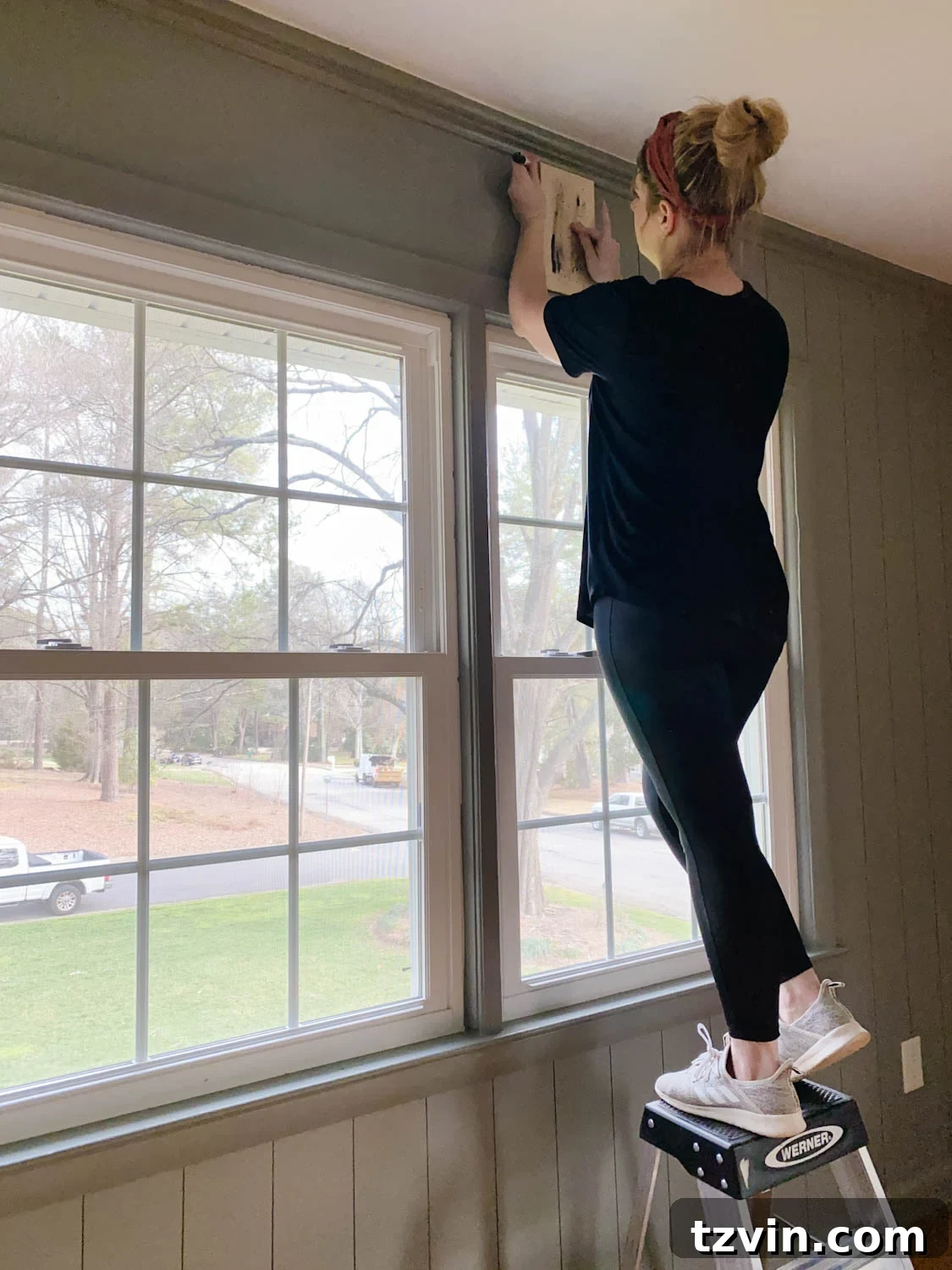 Tracing 1x6 boards with Sharpie paint pens for faux paneled walls over a window