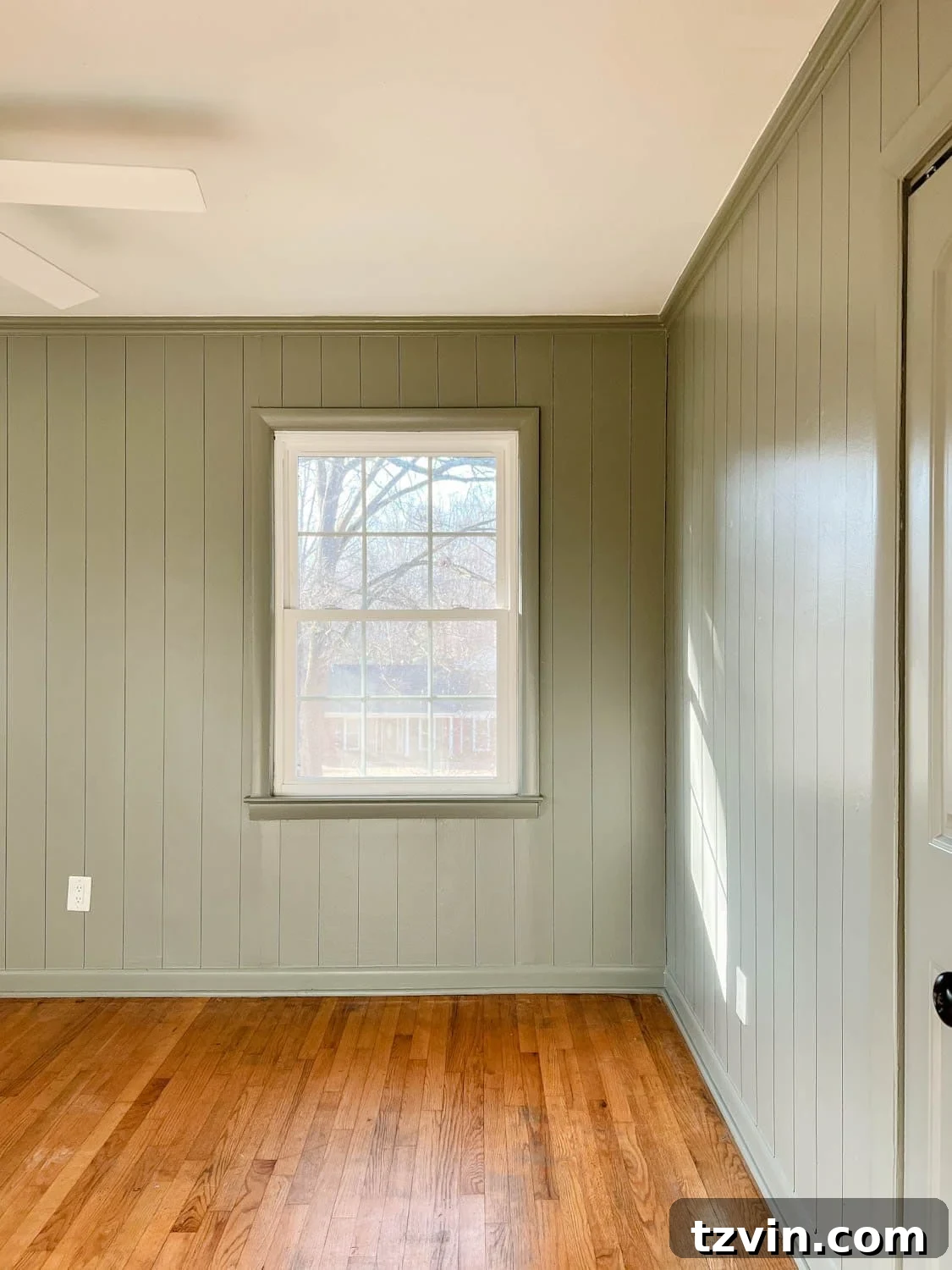 Bedroom painted Sherwin Williams Evergreen Fog with faux planked walls 
