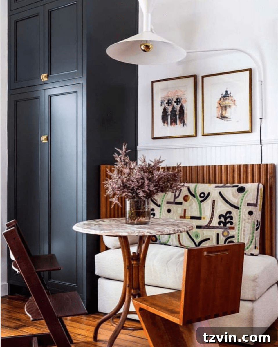 Small but mighty breakfast nook with unique furnishings and lighting