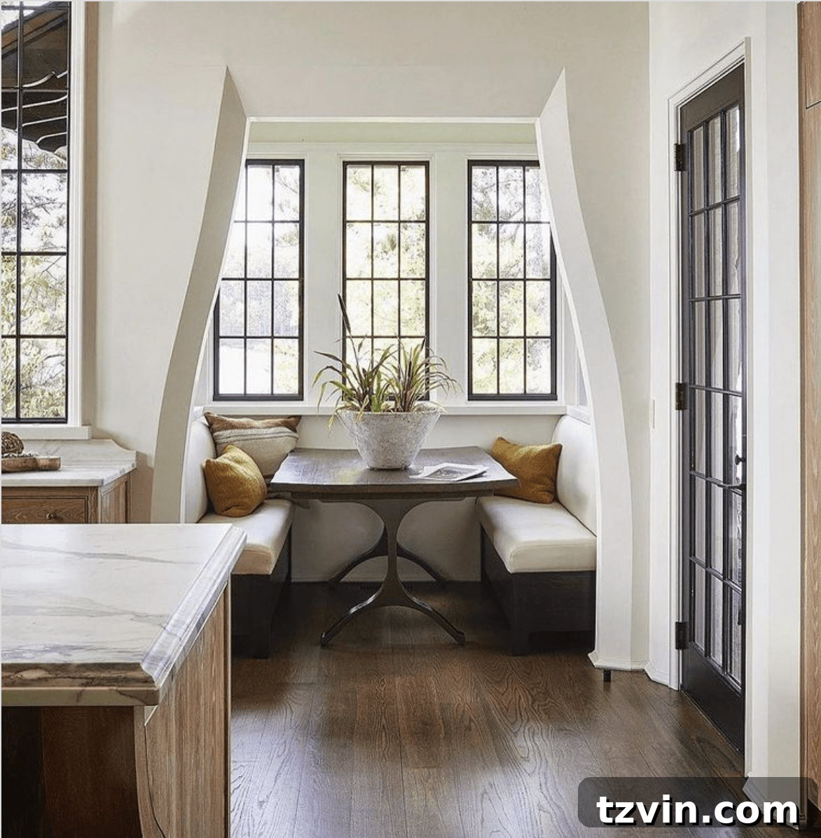 Walled-in breakfast nook defining a distinct and intimate dining space