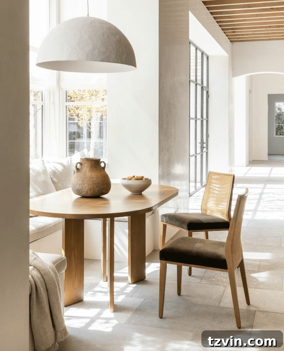 Breakfast nook with an oversized pendant light making a bold design statement