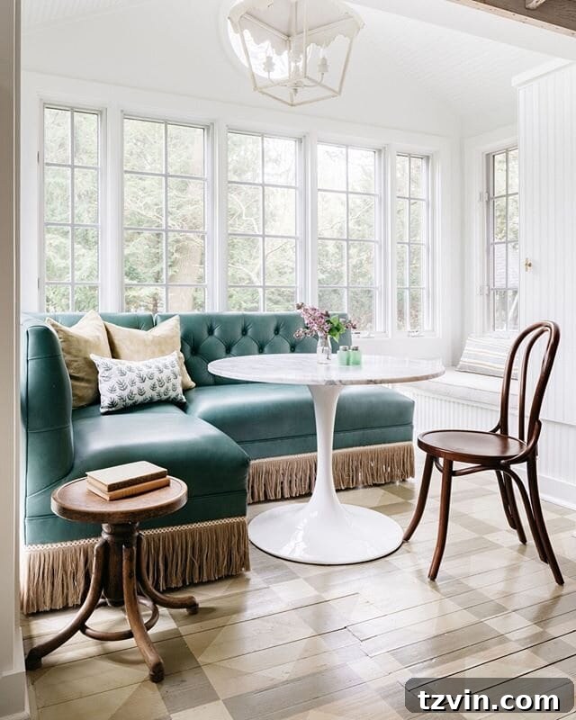 Upcycled restaurant booth banquette with modern tulip table in a kitchen nook