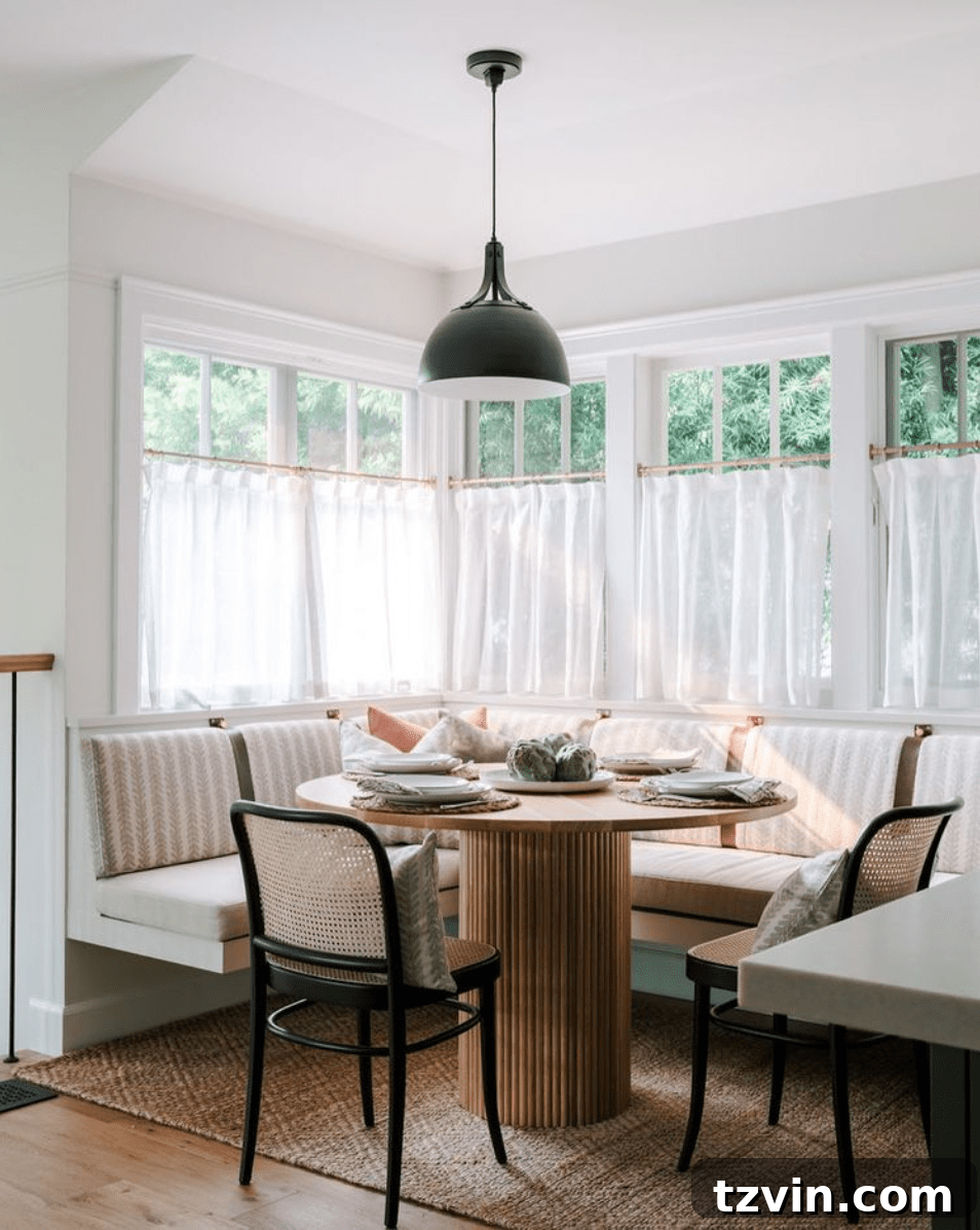 Dining nook with charming cafe curtains on kitchen windows for vintage appeal