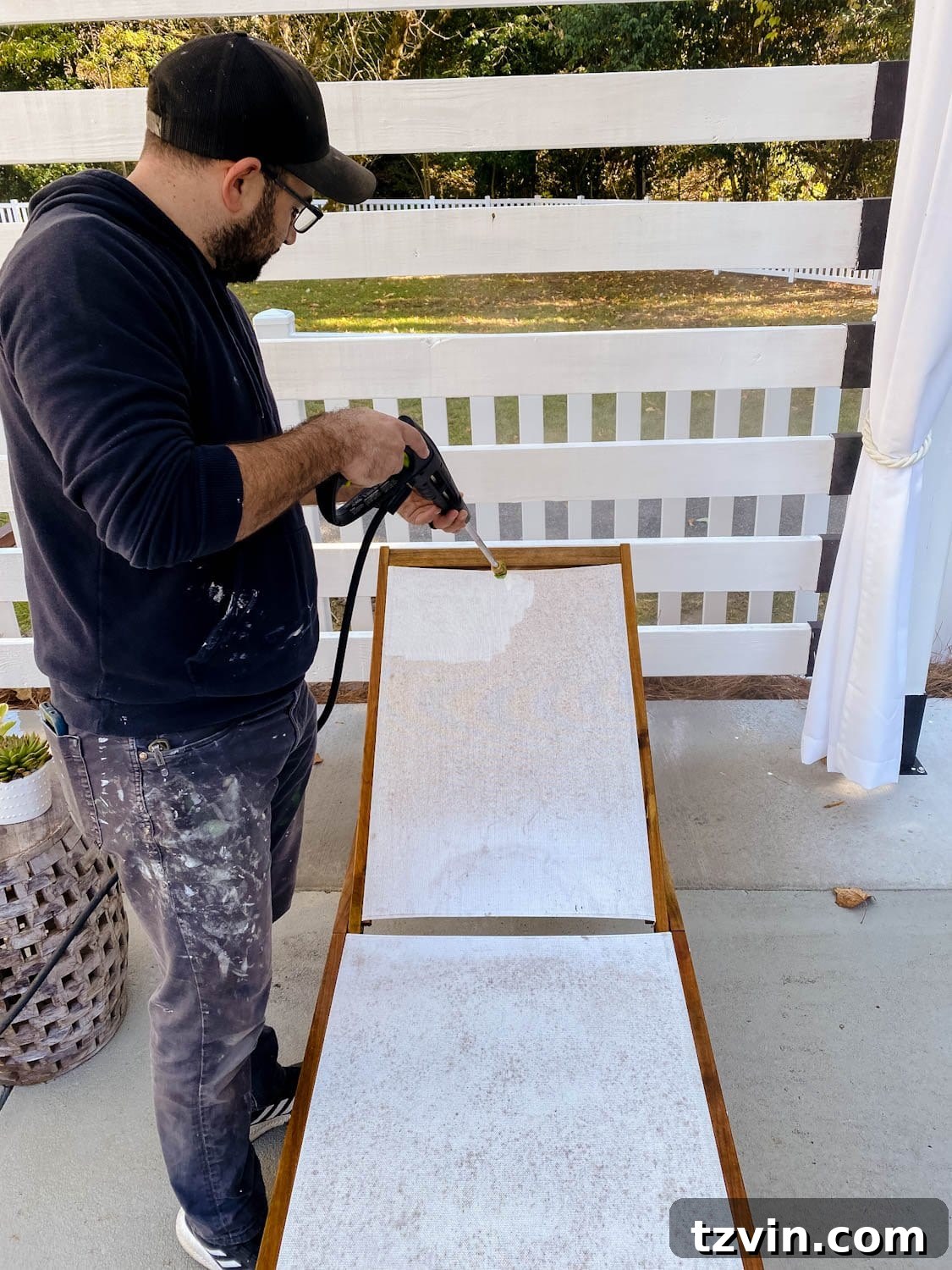 Cleaning outdoor furniture with a power washer showing visible results