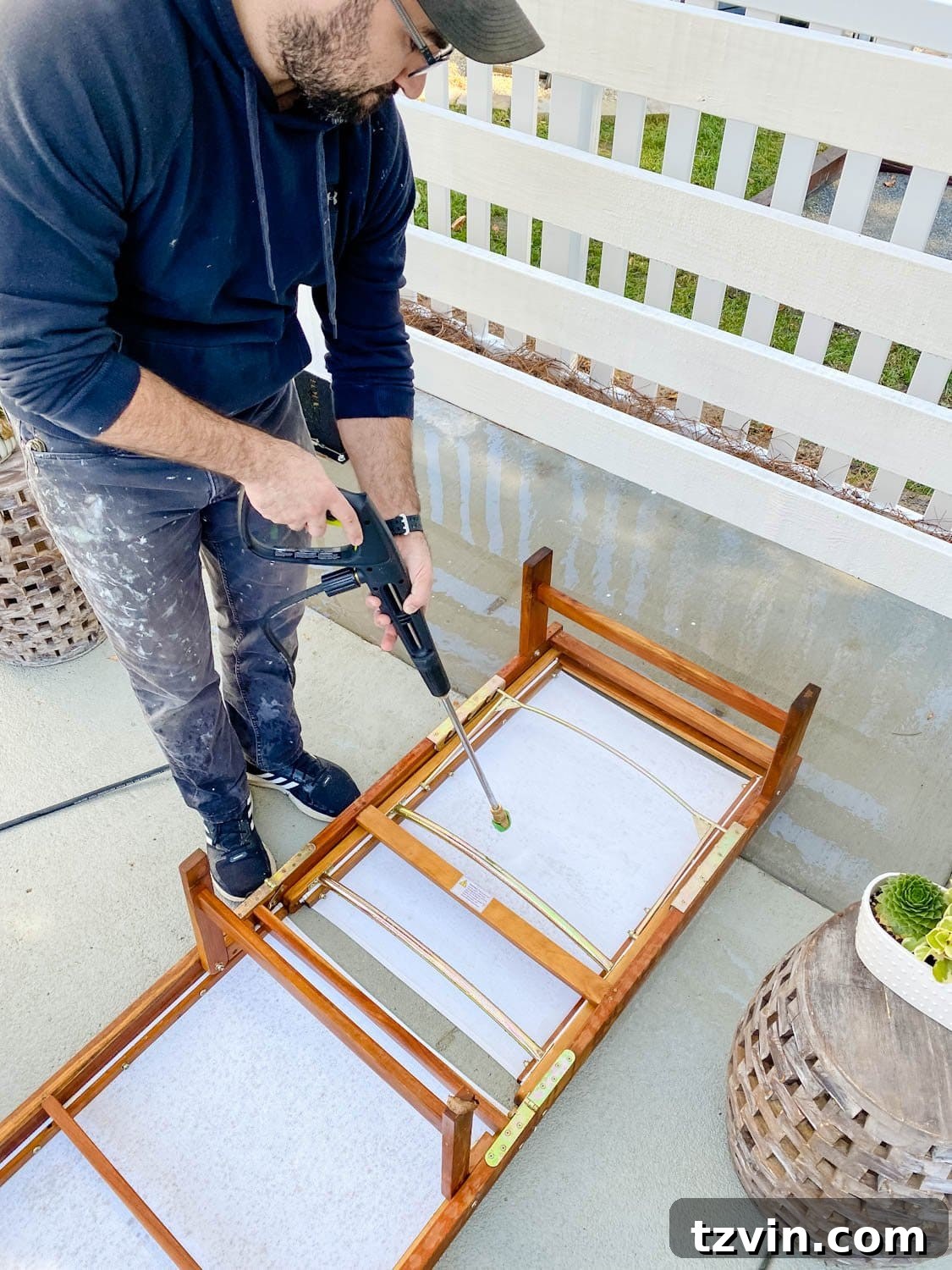 Outdoor furniture cleaning with a power washer, ensuring all sides are clean